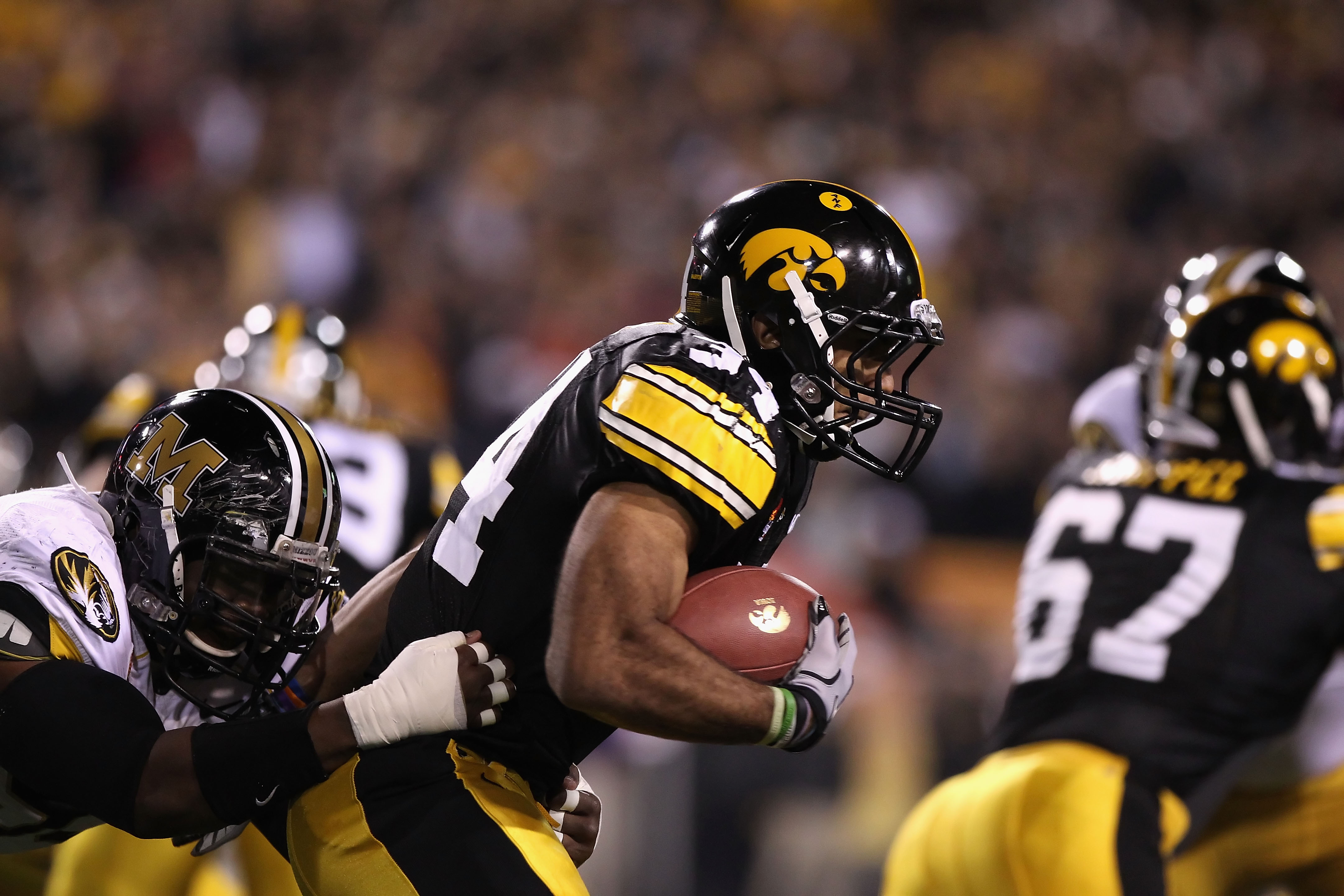 TEMPE, AZ - DECEMBER 28: Runningback Marcus Coker #34 of the Missouri Tigers runs with the football against the Iowa Hawkeyes during the Insight Bowl at Sun Devil Stadium on December 28, 2010 in Tempe, Arizona. (Photo by Christian Petersen/Getty Images) TEMPE, AZ - DECEMBER 28: Runningback Marcus Coker #34 of the Missouri Tigers runs with the football against the Iowa Hawkeyes during the Insight Bowl at Sun Devil Stadium on December 28, 2010 in Tempe, Arizona. (Photo by Christian Petersen/Getty Images)