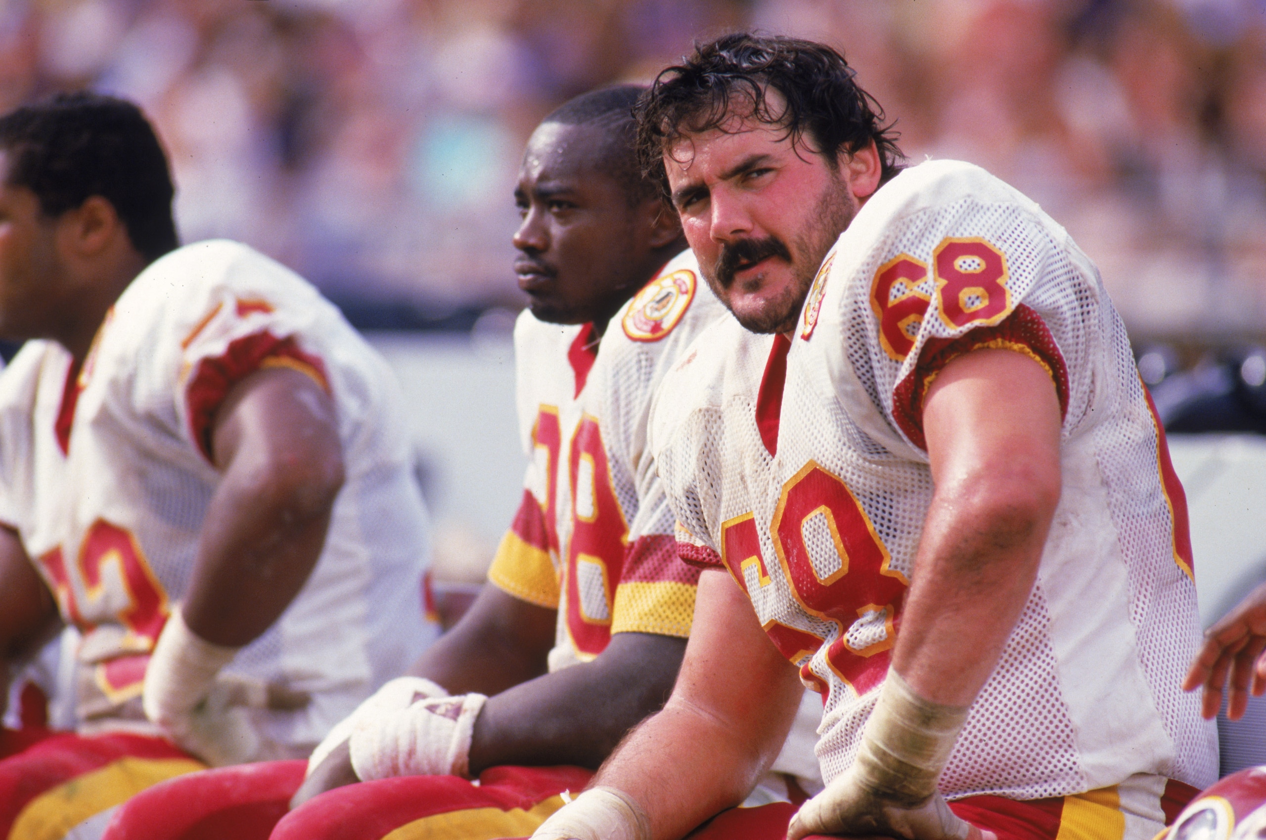 1987:  Offensive linebacker Russ Grimm #68 of the Washington Redskins sits on the bench during a 1987 season game. (Photo by Rick Stewart/Getty Images)