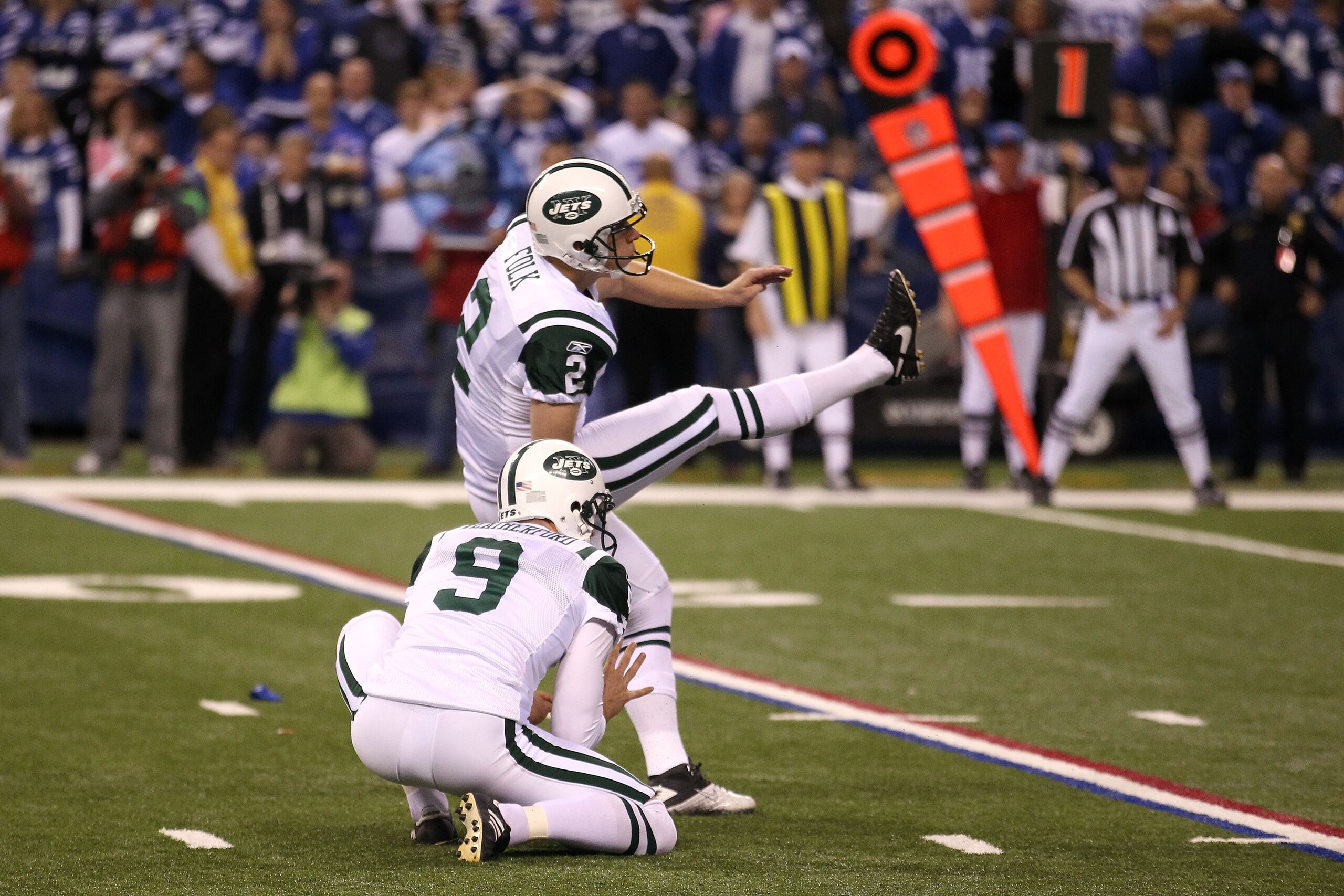 INDIANAPOLIS, IN - JANUARY 08:  Place kicker Nick Folk #2 of the New York Jets successfully kicks a game-winning a 32-yard field goal in the fourth quarter to win 17-16 against the Indianapolis Colts during their 2011 AFC wild card playoff game at Lucas O