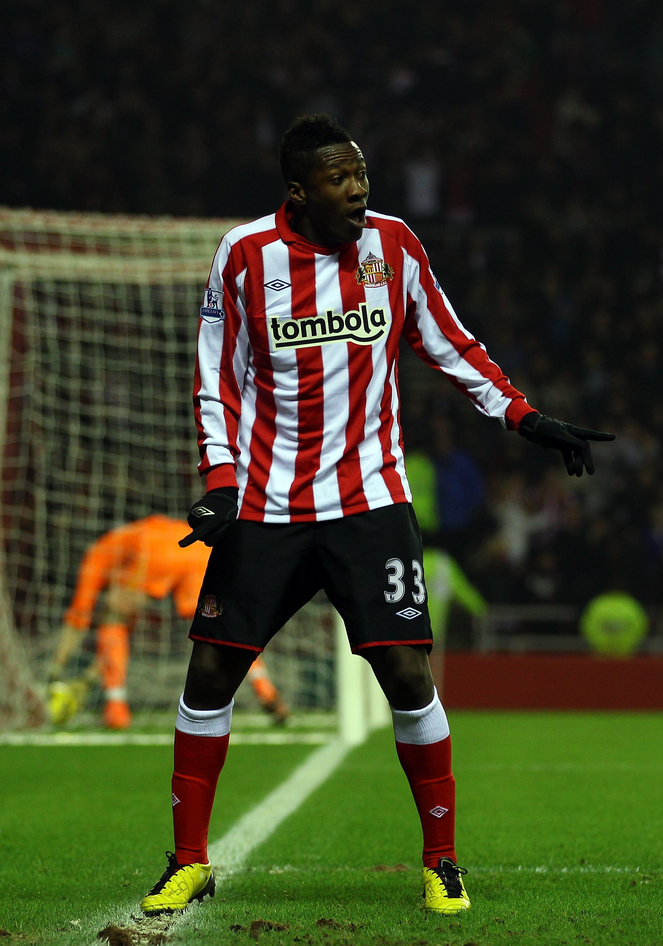 SUNDERLAND, ENGLAND - FEBRUARY 12:  Asamoah Gyan of Sunderland celebrates scoring the first goal during the Barclays Premier League match between Sunderland and Tottenham Hotspur at the Stadium of Light on February 12, 2011 in Sunderland, England.  (Photo
