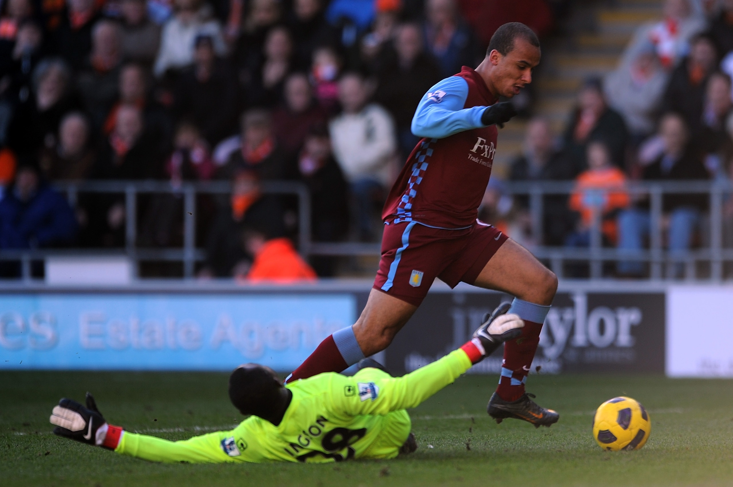 BLACKPOOL, ENGLAND - FEBRUARY 12: Gabriel Agbonlahor of Aston Villa rounds Richard Kingson of Blackpool before scoring the opening goal during the Barclays Premier League match between Blackpool and Aston Villa at Bloomfield Road on February 12, 2011 in BLACKPOOL, ENGLAND - FEBRUARY 12: Gabriel Agbonlahor of Aston Villa rounds Richard Kingson of Blackpool before scoring the opening goal during the Barclays Premier League match between Blackpool and Aston Villa at Bloomfield Road on February 12, 2011 in