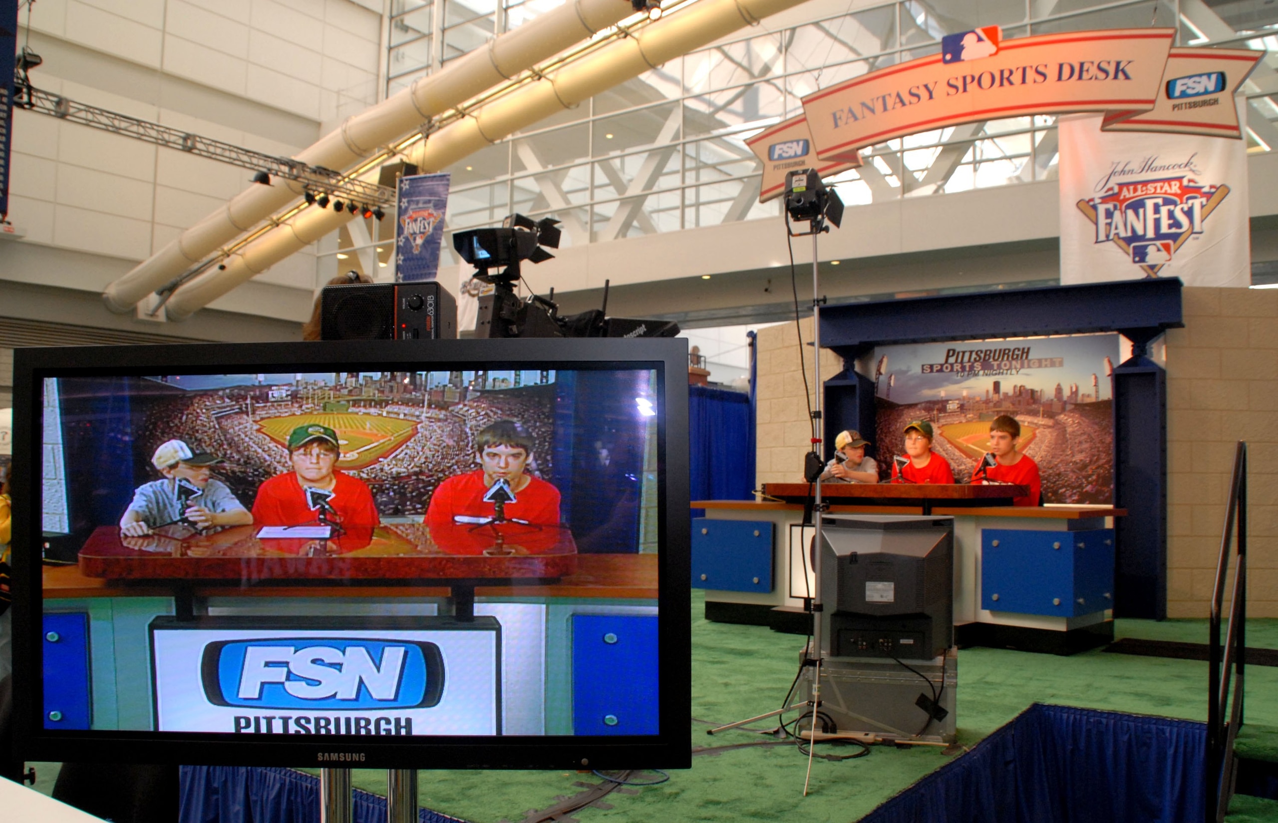 PITTSBURGH - JULY 7: (L-R) Fans Michael Kutilek, 12, Griffin Conley, 11, and Brody Smith, 13, of Oakmont, Pennsylvania, participate in a fantasy sports broadcast during the opening day of Fan Fest for the Major League Baseball 2006 All-Star game at the Da