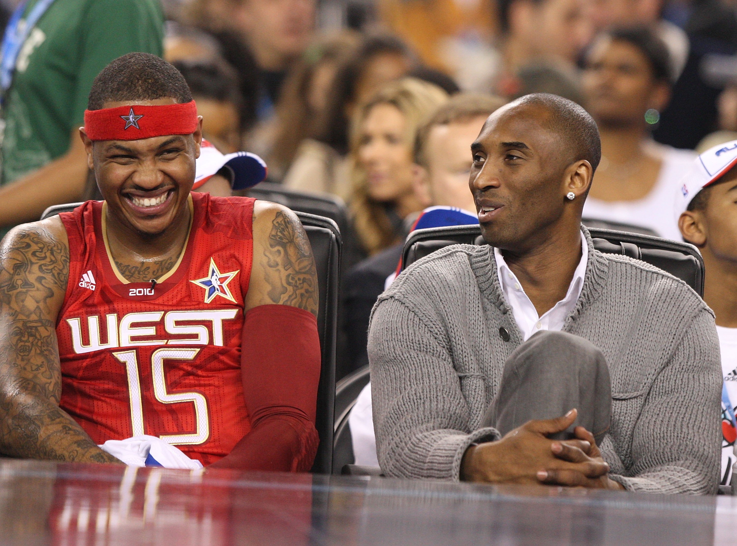 ARLINGTON, TX - FEBRUARY 14:  An injured Kobe Bryant sits on on the bench with Carmelo Anthony #15 of the Western All-Stars during the the NBA All-Star Game, part of 2010 NBA All-Star Weekend at Cowboys Stadium on February 14, 2010 in Arlington, Texas. NO