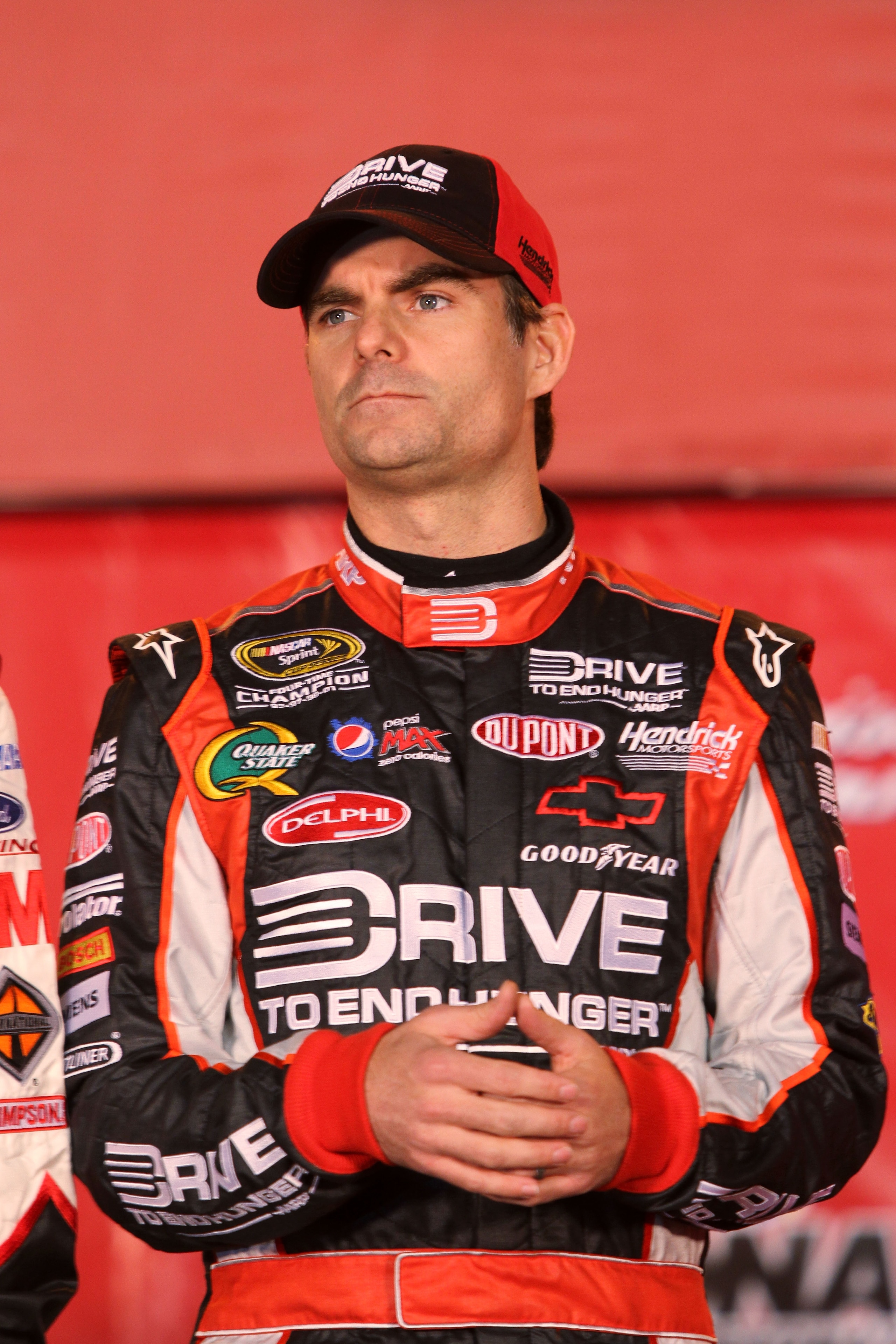 DAYTONA BEACH, FL - FEBRUARY 12: Jeff Gordon, driver of the #24 Drive to End Hunger Chevrolet, stands on stage during pre-race ceremonies prior to the NASCAR Budweiser Shootout at Daytona International Speedway on February 12, 2011 in Daytona Beach, Flor DAYTONA BEACH, FL - FEBRUARY 12: Jeff Gordon, driver of the #24 Drive to End Hunger Chevrolet, stands on stage during pre-race ceremonies prior to the NASCAR Budweiser Shootout at Daytona International Speedway on February 12, 2011 in Daytona Beach, Flor