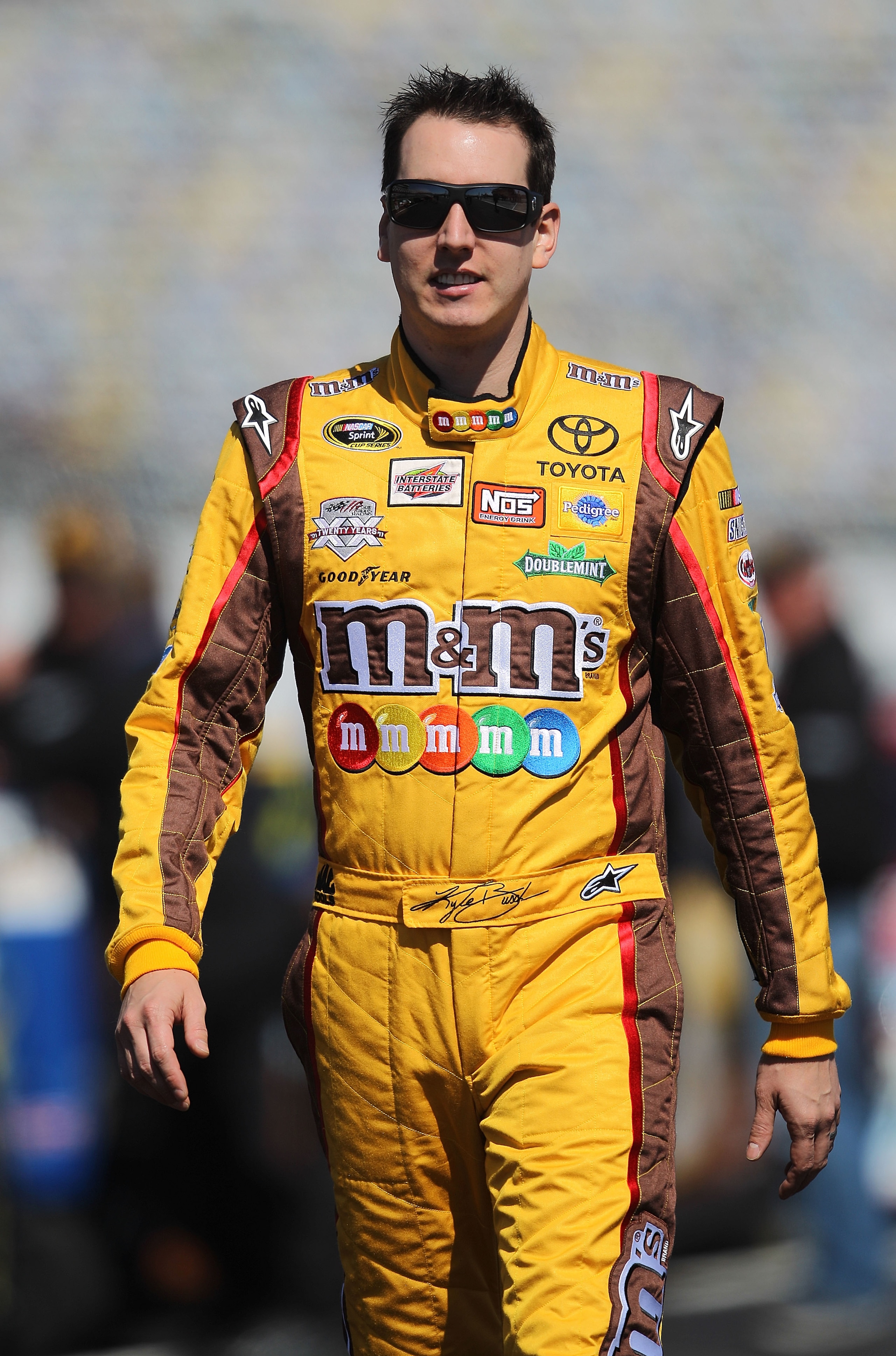 DAYTONA BEACH, FL - FEBRUARY 13: Kyle Busch, driver of the #18 M&M's Toyota, walks during qualifying for the NASCAR Sprint Cup Series Daytona 500 at Daytona International Speedway on February 13, 2011 in Daytona Beach, Florida. (Photo by Nick Laham/Gett DAYTONA BEACH, FL - FEBRUARY 13: Kyle Busch, driver of the #18 M&M's Toyota, walks during qualifying for the NASCAR Sprint Cup Series Daytona 500 at Daytona International Speedway on February 13, 2011 in Daytona Beach, Florida. (Photo by Nick Laham/Gett