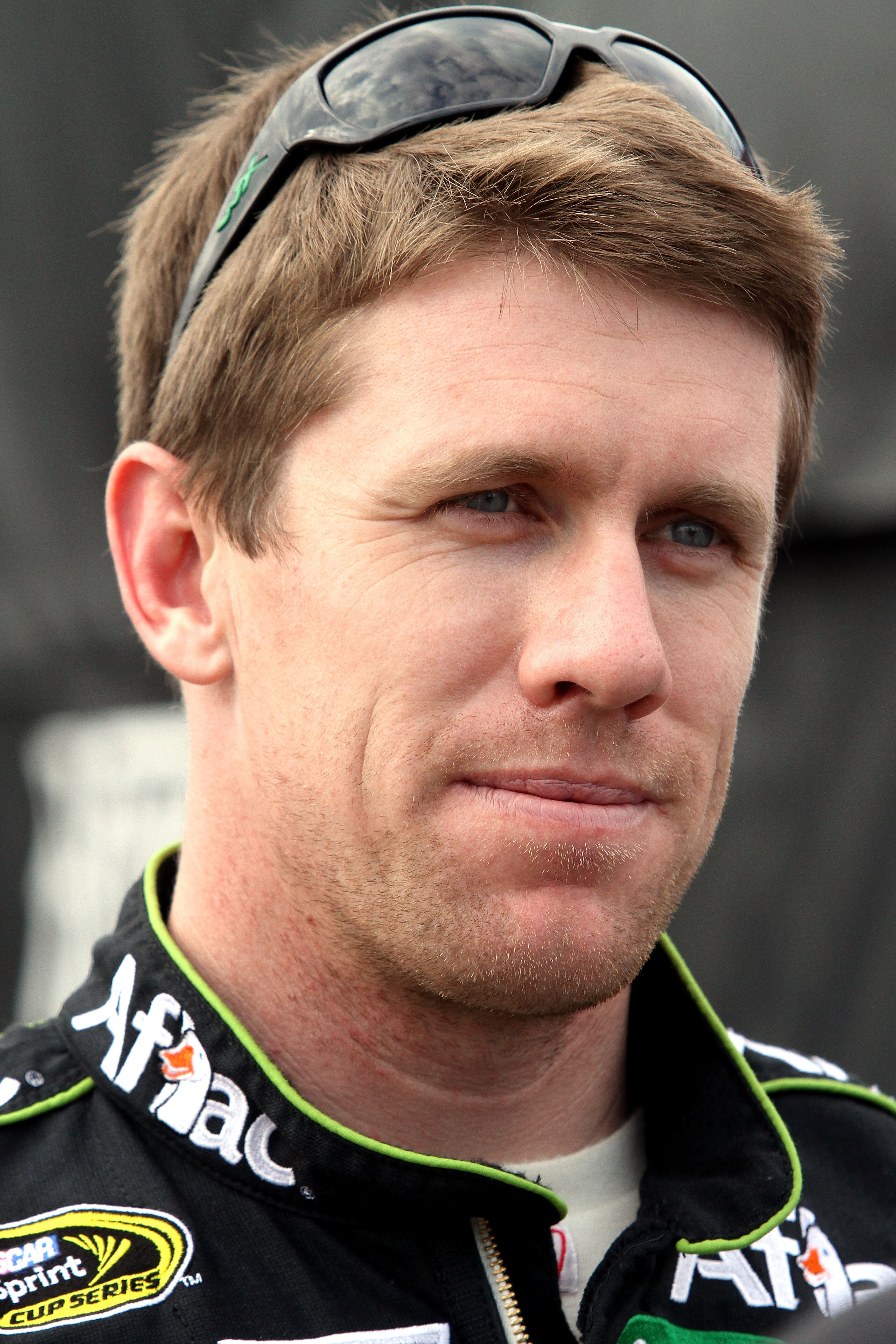 DAYTONA BEACH, FL - FEBRUARY 16:  Carl Edwards, driver of the #99 Aflac Ford, looks on in the garage area during practice for the NASCAR Sprint Cup Series Daytona 500 at Daytona International Speedway on February 16, 2011 in Daytona Beach, Florida.  (Phot