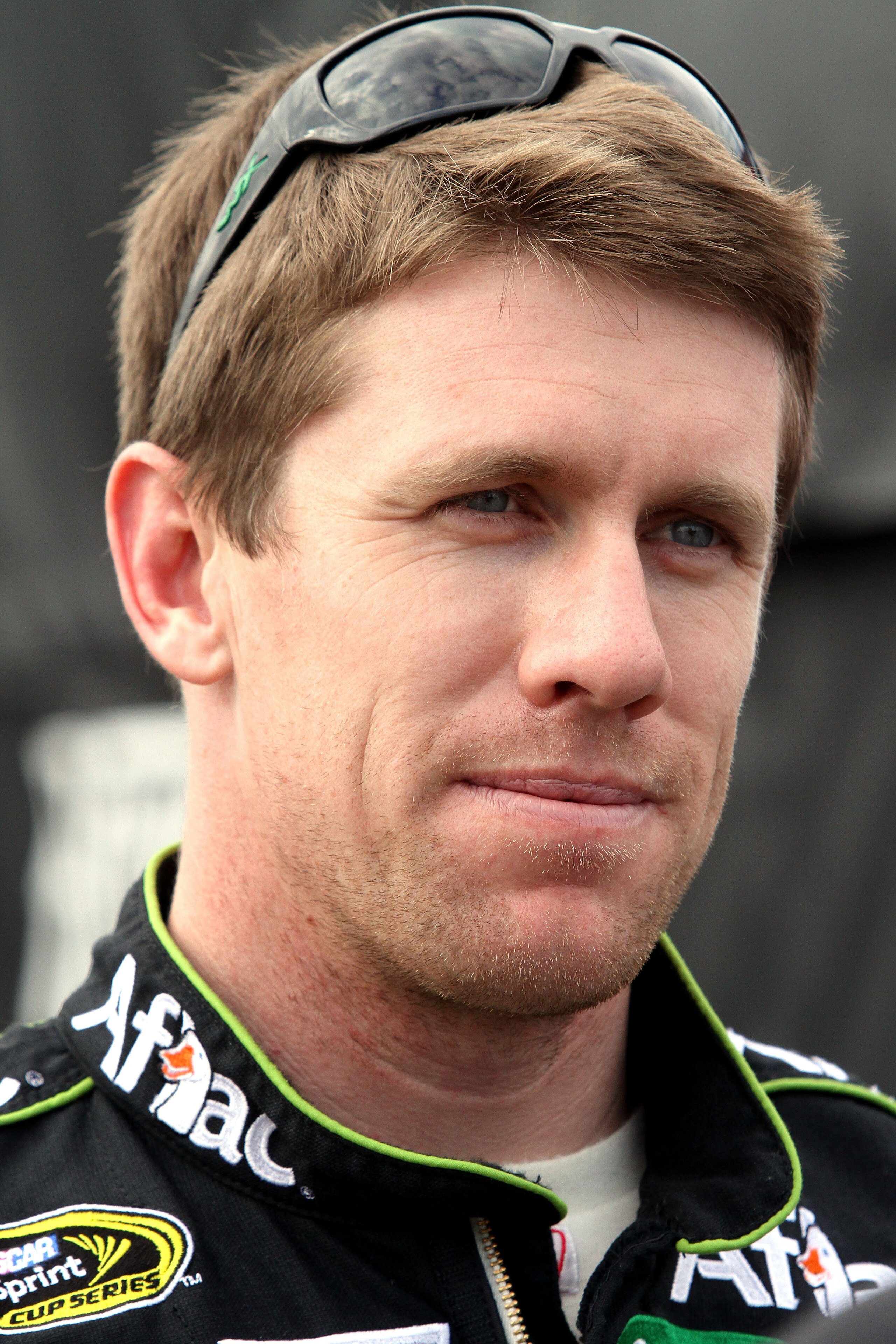 DAYTONA BEACH, FL - FEBRUARY 16: Carl Edwards, driver of the #99 Aflac Ford, looks on in the garage area during practice for the NASCAR Sprint Cup Series Daytona 500 at Daytona International Speedway on February 16, 2011 in Daytona Beach, Florida. (Phot DAYTONA BEACH, FL - FEBRUARY 16: Carl Edwards, driver of the #99 Aflac Ford, looks on in the garage area during practice for the NASCAR Sprint Cup Series Daytona 500 at Daytona International Speedway on February 16, 2011 in Daytona Beach, Florida. (Phot
