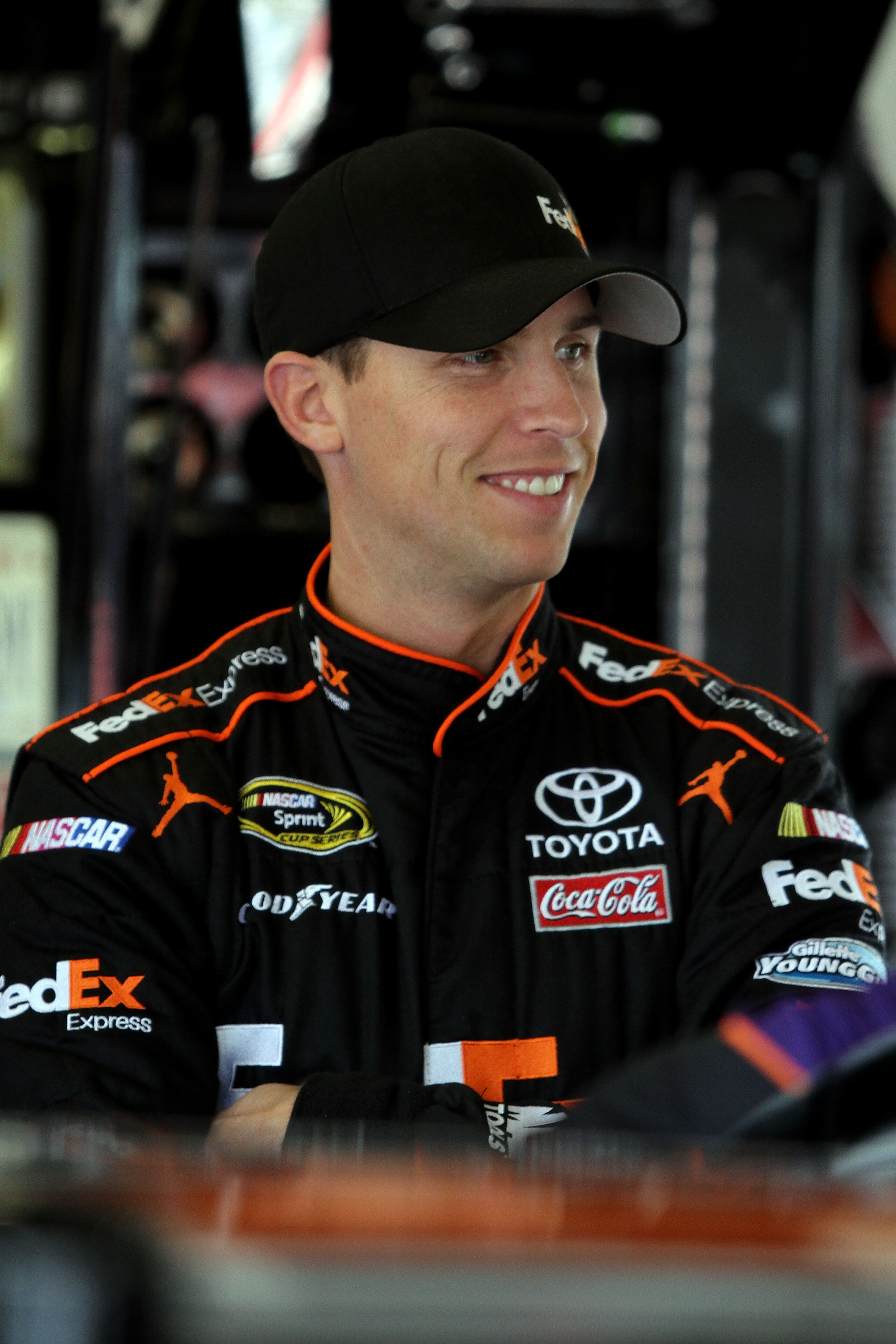 DAYTONA BEACH, FL - FEBRUARY 16: Denny Hamlin, driver of the #11 FedEx Toyota, looks on in the garage area during practice for the NASCAR Sprint Cup Series Daytona 500 at Daytona International Speedway on February 16, 2011 in Daytona Beach, Florida. (Ph DAYTONA BEACH, FL - FEBRUARY 16: Denny Hamlin, driver of the #11 FedEx Toyota, looks on in the garage area during practice for the NASCAR Sprint Cup Series Daytona 500 at Daytona International Speedway on February 16, 2011 in Daytona Beach, Florida. (Ph