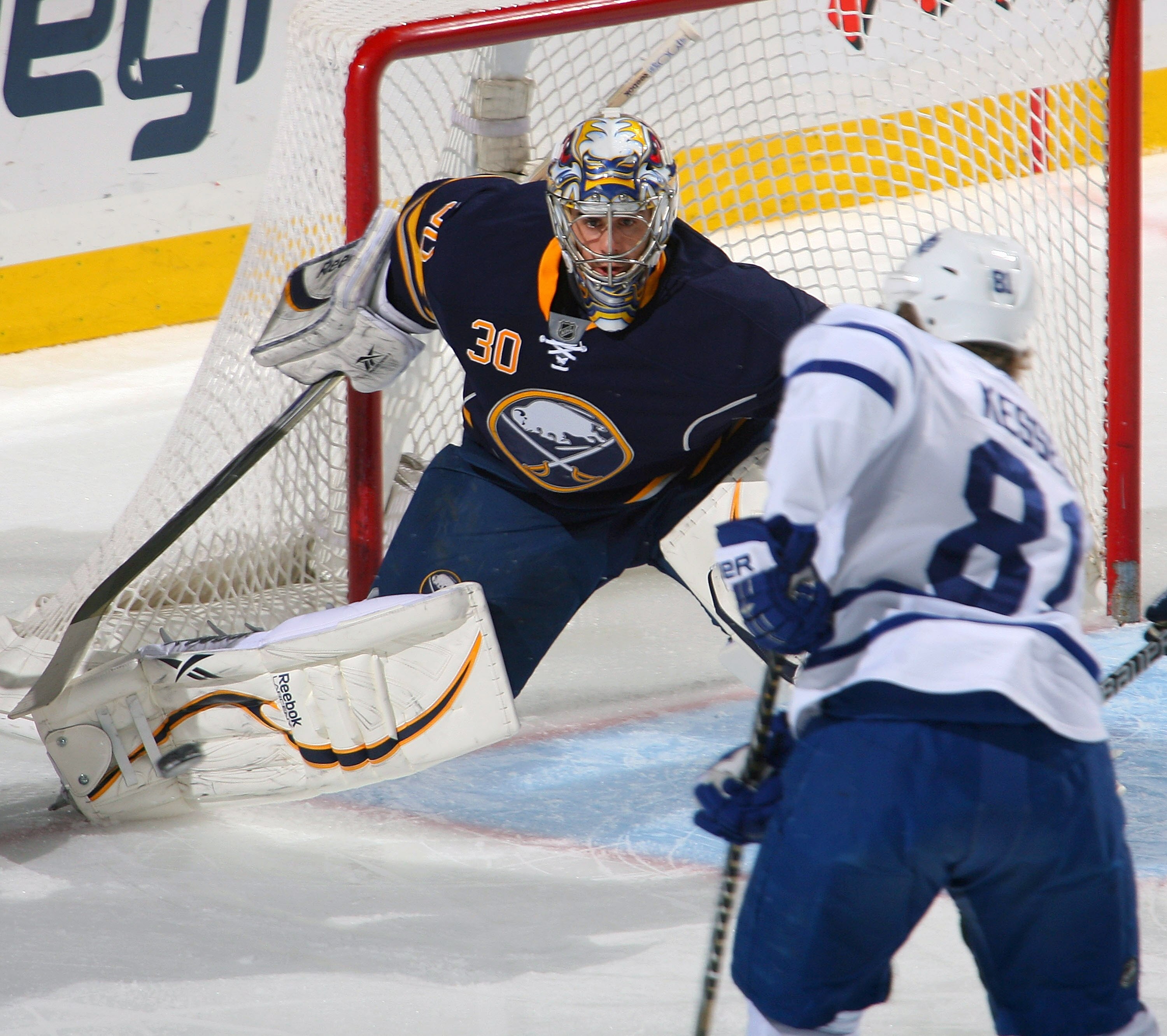 BUFFALO, NY - FEBRUARY 16: Ryan Miller #30 of the Buffalo Sabres moves to get in position against Phil Kessel #81 of the Toronto Maple Leafs at HSBC Arena on February 16, 2011 in Buffalo, New York.  (Photo by Rick Stewart/Getty Images)