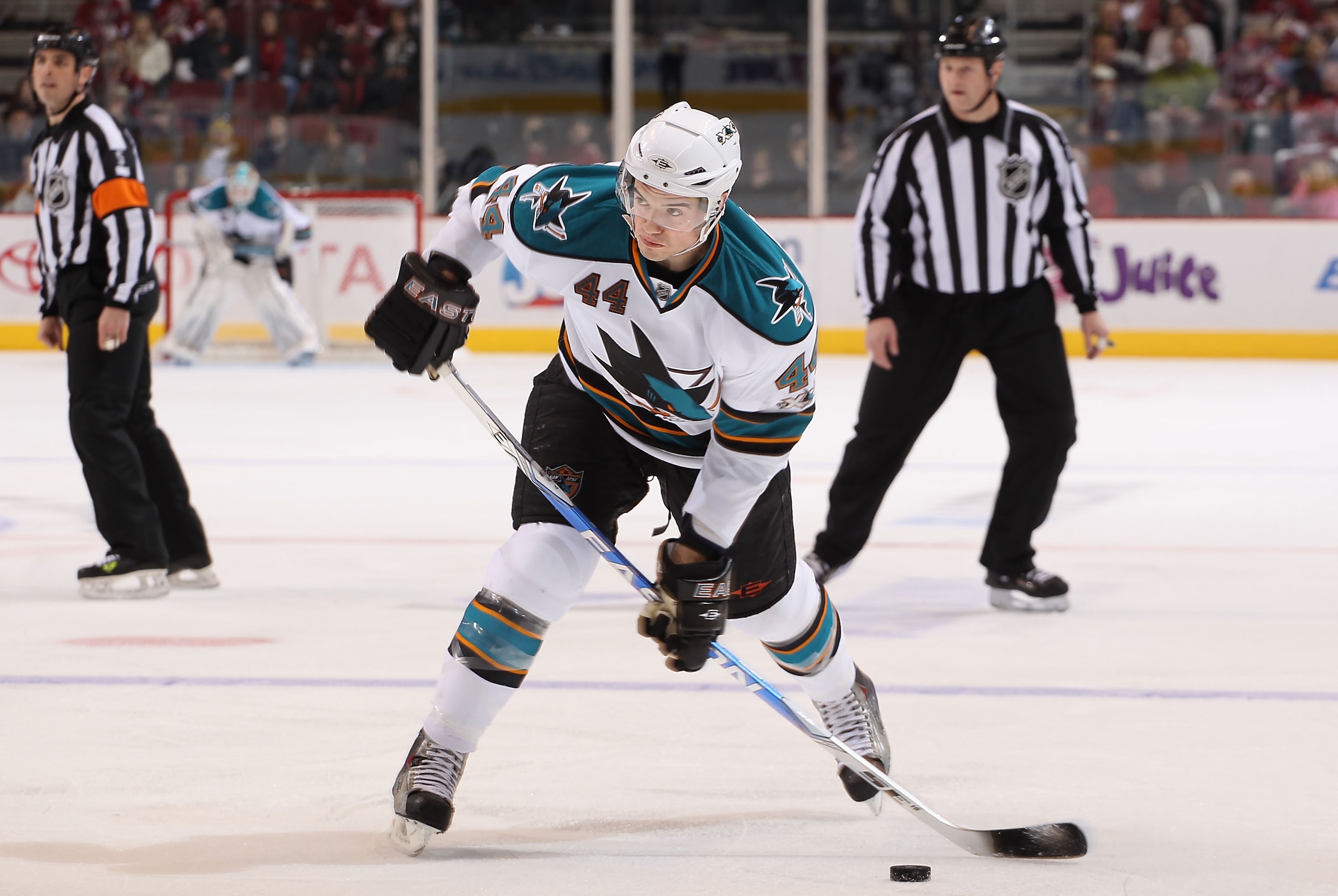 GLENDALE, AZ - JANUARY 17:  Marc-Edouard Vlasic #44 of the San Jose Sharks hanldes the puck during the NHL game against the Phoenix Coyotes at Jobing.com Arena on January 17, 2011 in Glendale, Arizona.  The Sharks defeated the Coyotes 4-2.  (Photo by Chri