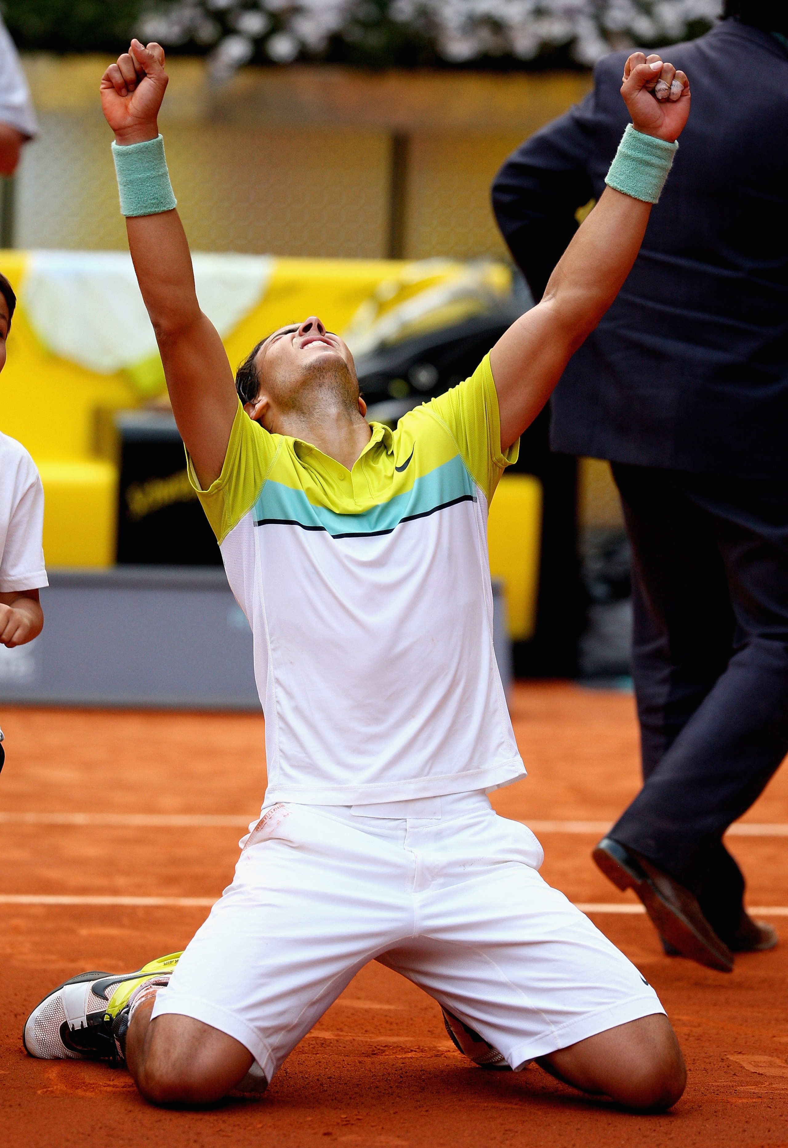 MADRID, SPAIN - MAY 16:  Rafael Nadal of Spain celebrates on his knees after match point against Novak Djokovic of Serbia in their semi-final during the Madrid Open tennis tournament at the Caja Magica on May 16, 2009 in Madrid, Spain.  (Photo by Clive Br