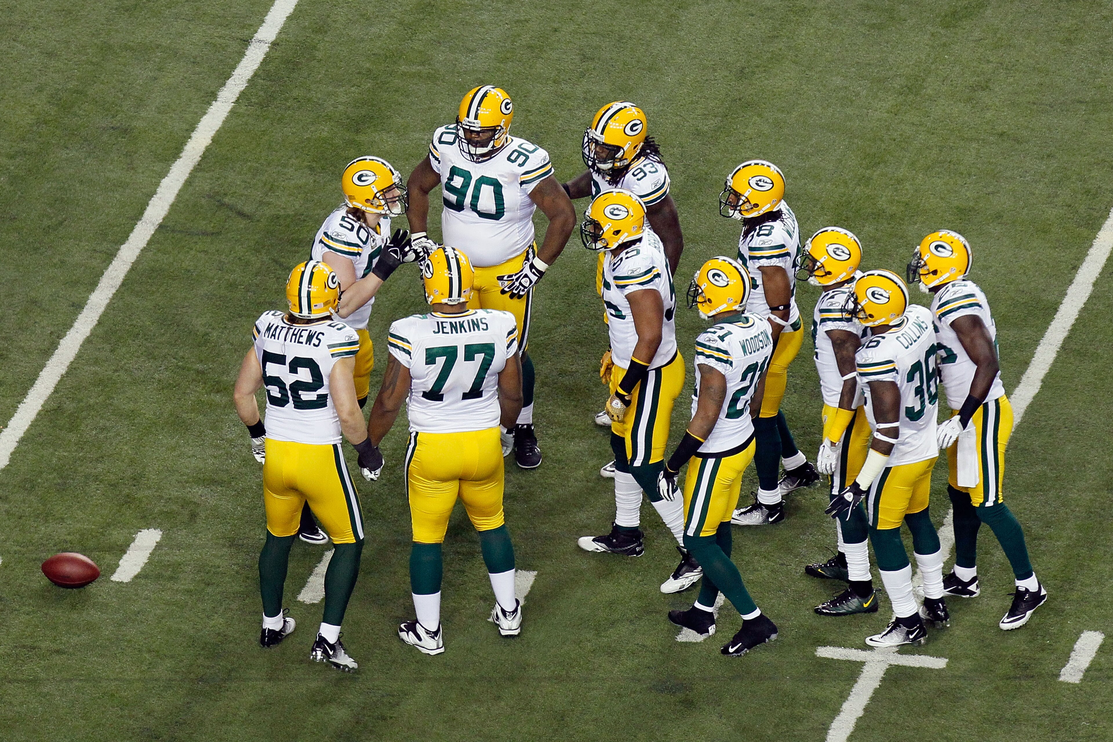 ATLANTA, GA - JANUARY 15: A.J. Hawk #50 of the Green Bay Packers calls a play in the defensive huddle to teammates including Clay Matthews #52 and B.J. Raji #90 against the Atlanta Falcons during their 2011 NFC divisional playoff game at Georgia Dome on ATLANTA, GA - JANUARY 15: A.J. Hawk #50 of the Green Bay Packers calls a play in the defensive huddle to teammates including Clay Matthews #52 and B.J. Raji #90 against the Atlanta Falcons during their 2011 NFC divisional playoff game at Georgia Dome on