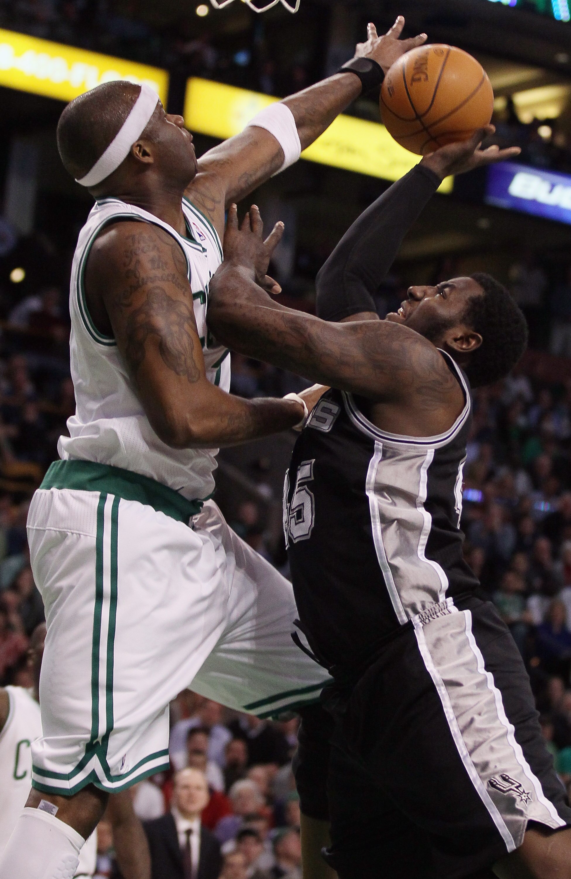 BOSTON, MA - JANUARY 05:  Jermaine O'Neal #7 of the Boston Celtics blocks a shot by DeJuan Blair #45 of the San Antonio Spurs on January 5, 2011 at the TD Garden in Boston, Massachusetts. The Celtics defeated the Spurs 105-103. NOTE TO USER: User expressl