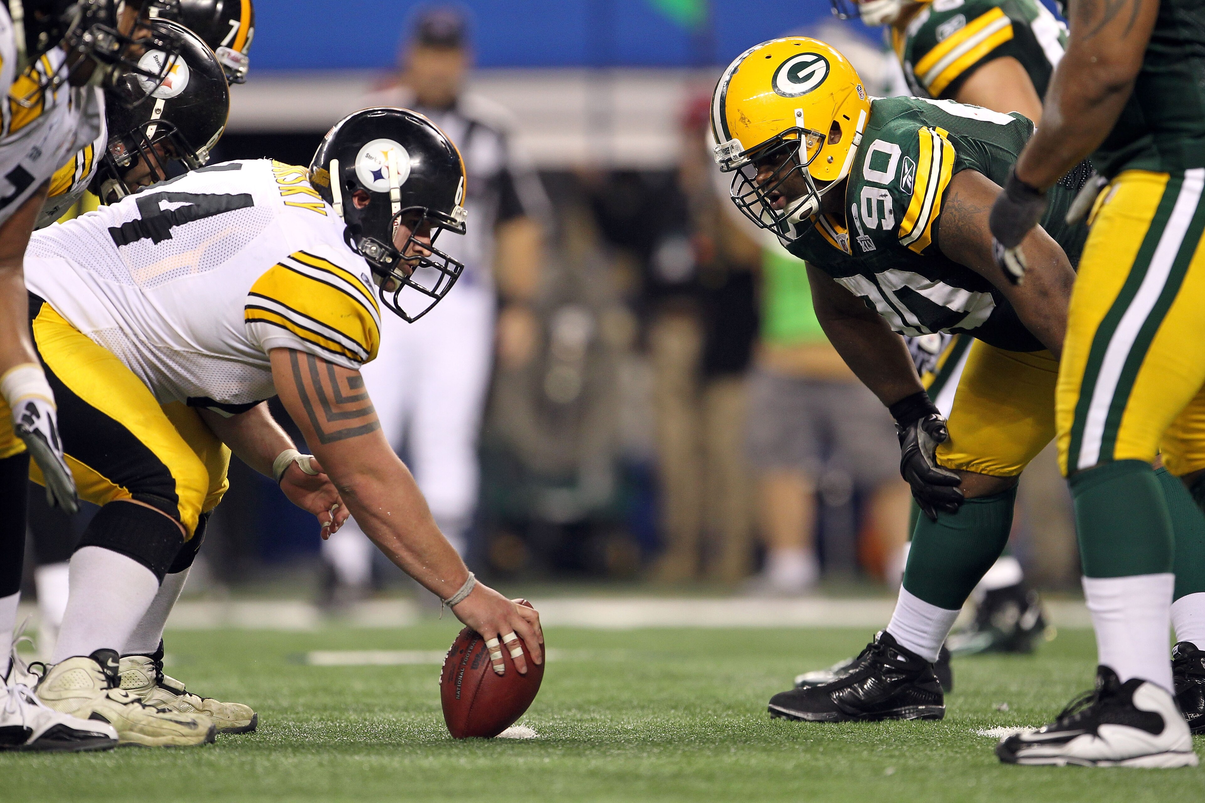 ARLINGTON, TX - FEBRUARY 06: Doug Legursky #64 of the Pittsburgh Steelers readies to snap the ball at the line of scrimmage against B.J. Raji #90 of the Green Bay Packers during Super Bowl XLV at Cowboys Stadium on February 6, 2011 in Arlington, Texas. ARLINGTON, TX - FEBRUARY 06: Doug Legursky #64 of the Pittsburgh Steelers readies to snap the ball at the line of scrimmage against B.J. Raji #90 of the Green Bay Packers during Super Bowl XLV at Cowboys Stadium on February 6, 2011 in Arlington, Texas.