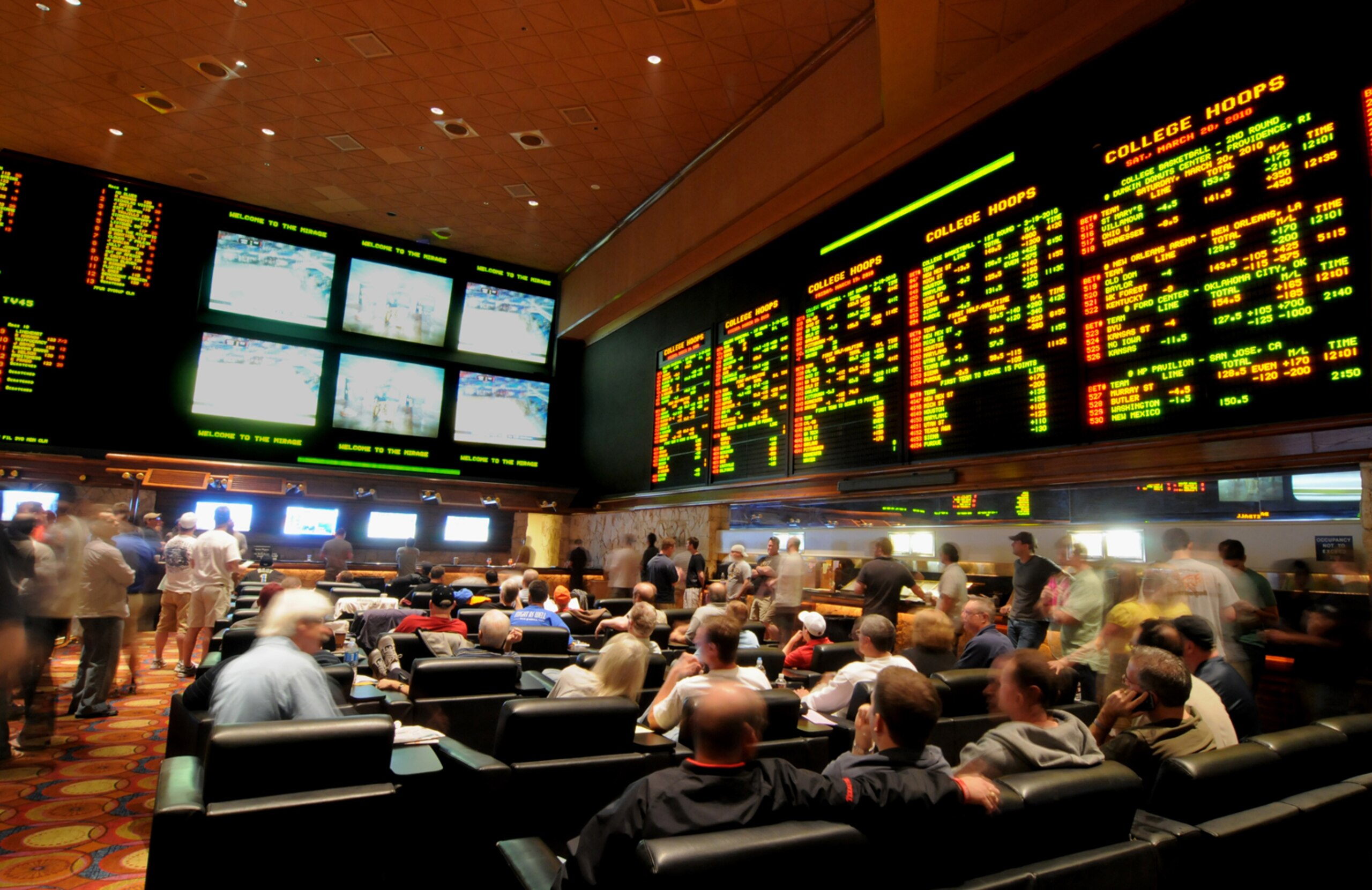 LAS VEGAS - MARCH 19: In this handout provided by the Las Vegas News Bureau, the Mirage Resort Race and Sports Book in Las Vegas is shown crowded with basketball fans during NCAA March Madness Tournament March 19, 2010. in Las Vegas, Nevada.  (Photo by Gl