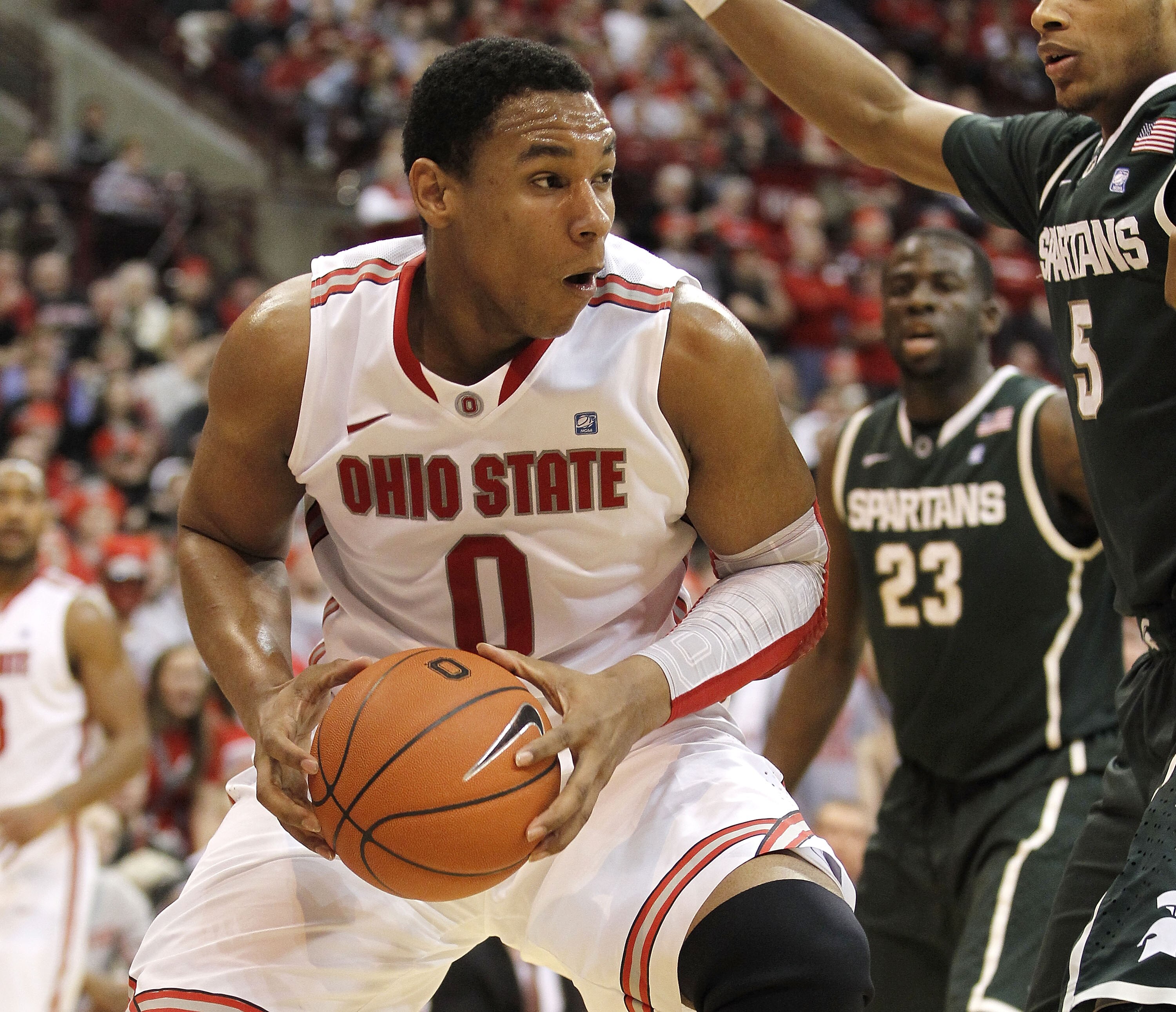 COLUMBUS, OH - FEBRUARY 15: Jared Sullinger #0 of the Ohio State Buckeyes drives against Adreian Payne #5 of the Michigan State Spartans during the second half on February 15, 2011 at Value City Arena in Columbus, Ohio. Ohio State defeated Michigan State