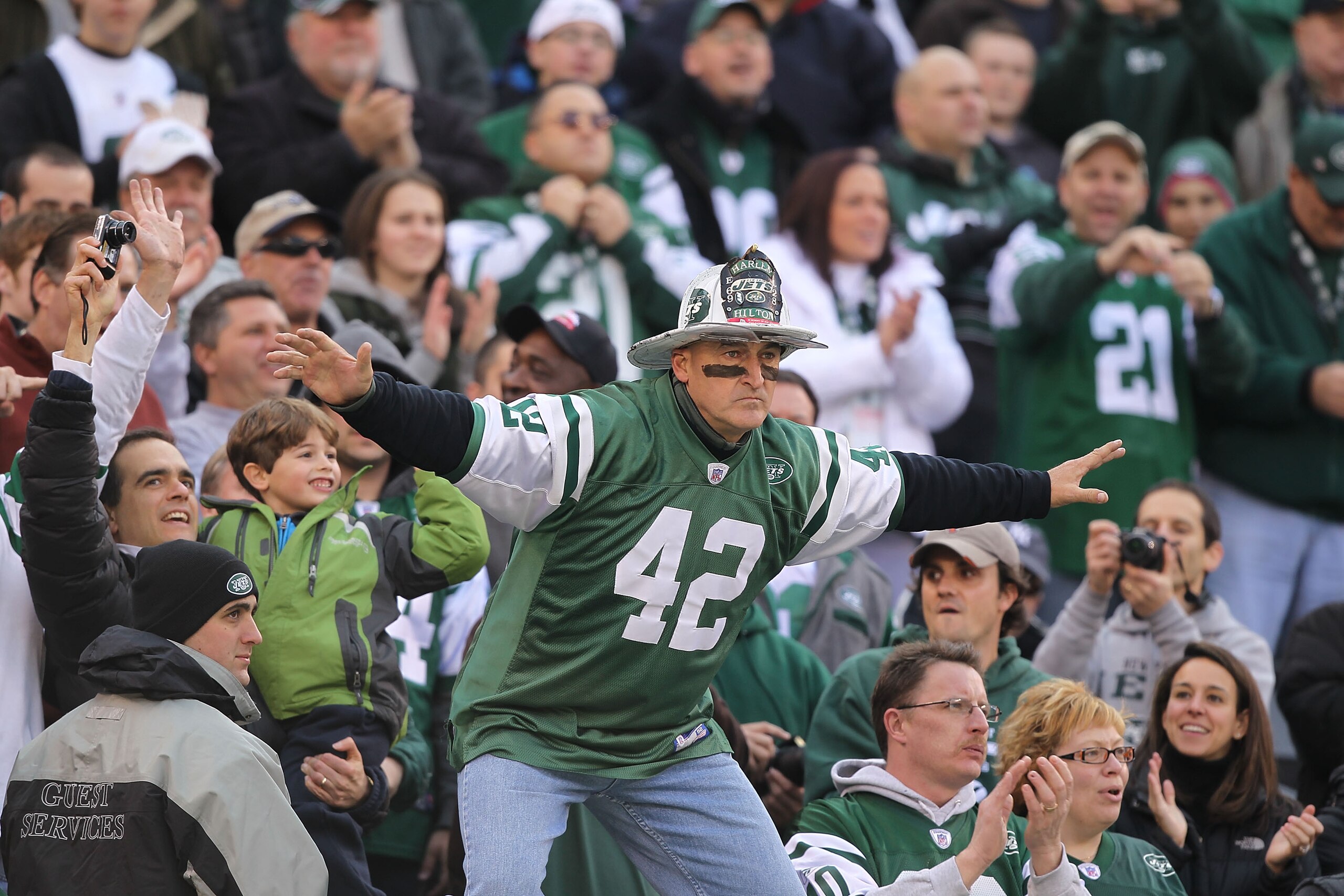 EAST RUTHERFORD, NJ - NOVEMBER 21:  Ed Anzalone, alias Fireman Eddie,  super fan of the New York Jets leads a cheer against the Houston Texans during their  game on November21, 2010 at the New Meadowlands Stadium  in East Rutherford, New Jersey.  (Photo b