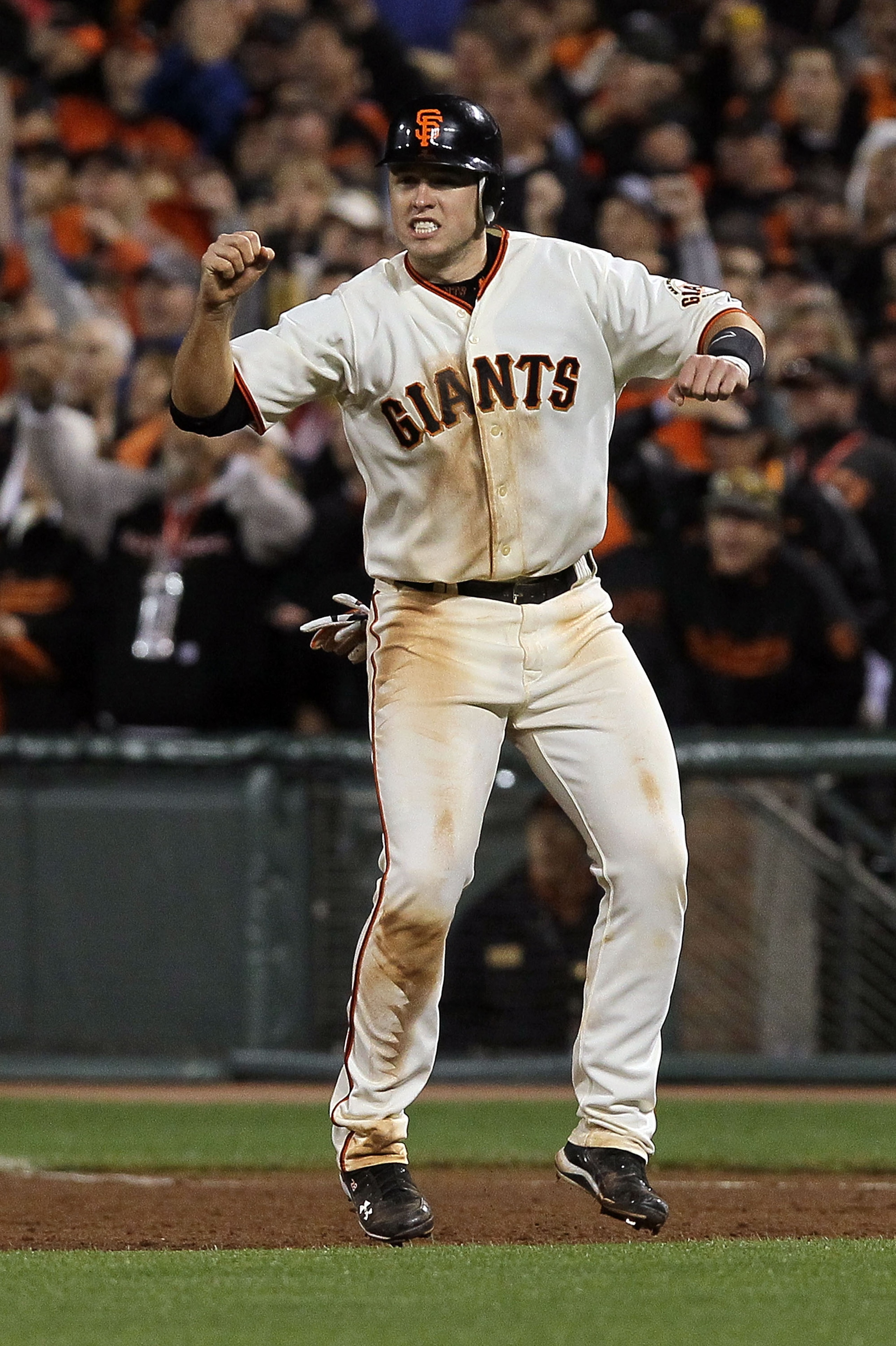SAN FRANCISCO - OCTOBER 20: Buster Posey #28 of the San Francisco Giants reacts to Juan Uribe #5 hitting a sacrifice fly, scoring Aubrey Huff #17 to win 6-5 over the Philadelphia Phillies in Game Four of the NLCS during the 2010 MLB Playoffs at AT&T Park SAN FRANCISCO - OCTOBER 20: Buster Posey #28 of the San Francisco Giants reacts to Juan Uribe #5 hitting a sacrifice fly, scoring Aubrey Huff #17 to win 6-5 over the Philadelphia Phillies in Game Four of the NLCS during the 2010 MLB Playoffs at AT&T Park