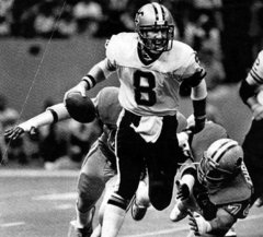 Quarterback Archie Manning of the Houston Oilers loses the ball as he is  sacked by George Martin of the New York Giants in the final minutes of  their game at Giants Stadium