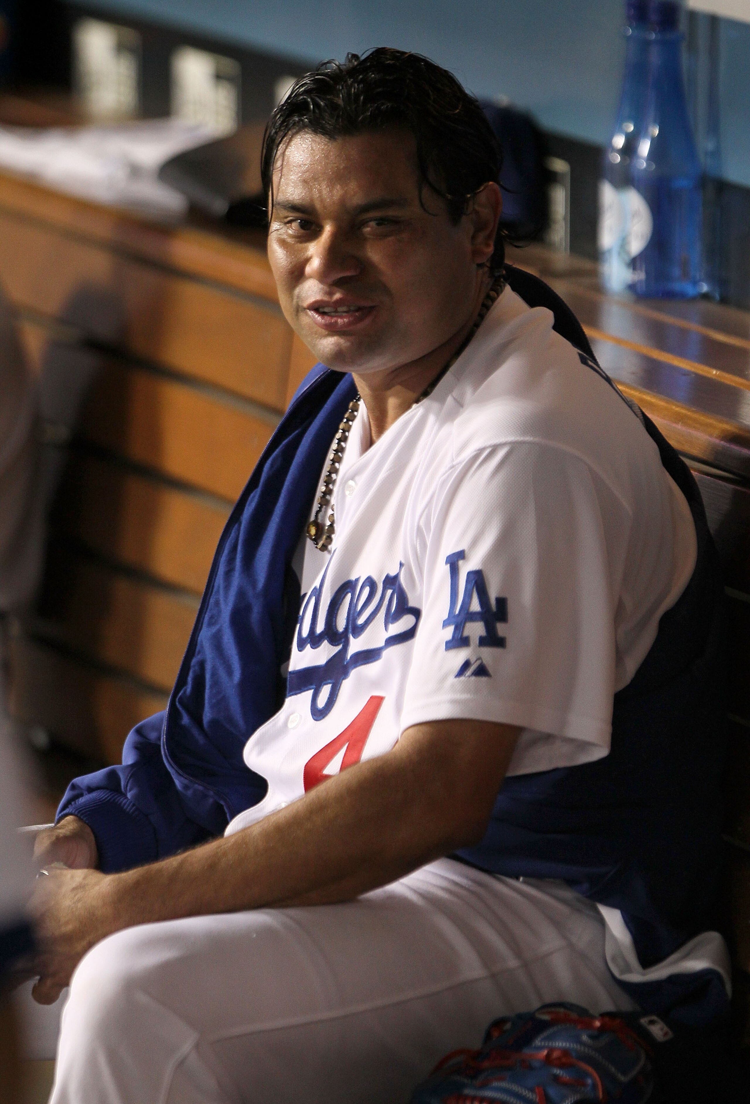LOS ANGELES, CA - AUGUST 04:  Starting pitcher Vicente Padilla #44 of the Los Angeles Dodgers rests in the dug out against the San Diego Padres at Dodger Stadium on August 4, 2010 in Los Angeles, California. The Dodgers defeated the Padres 9-0.  (Photo by