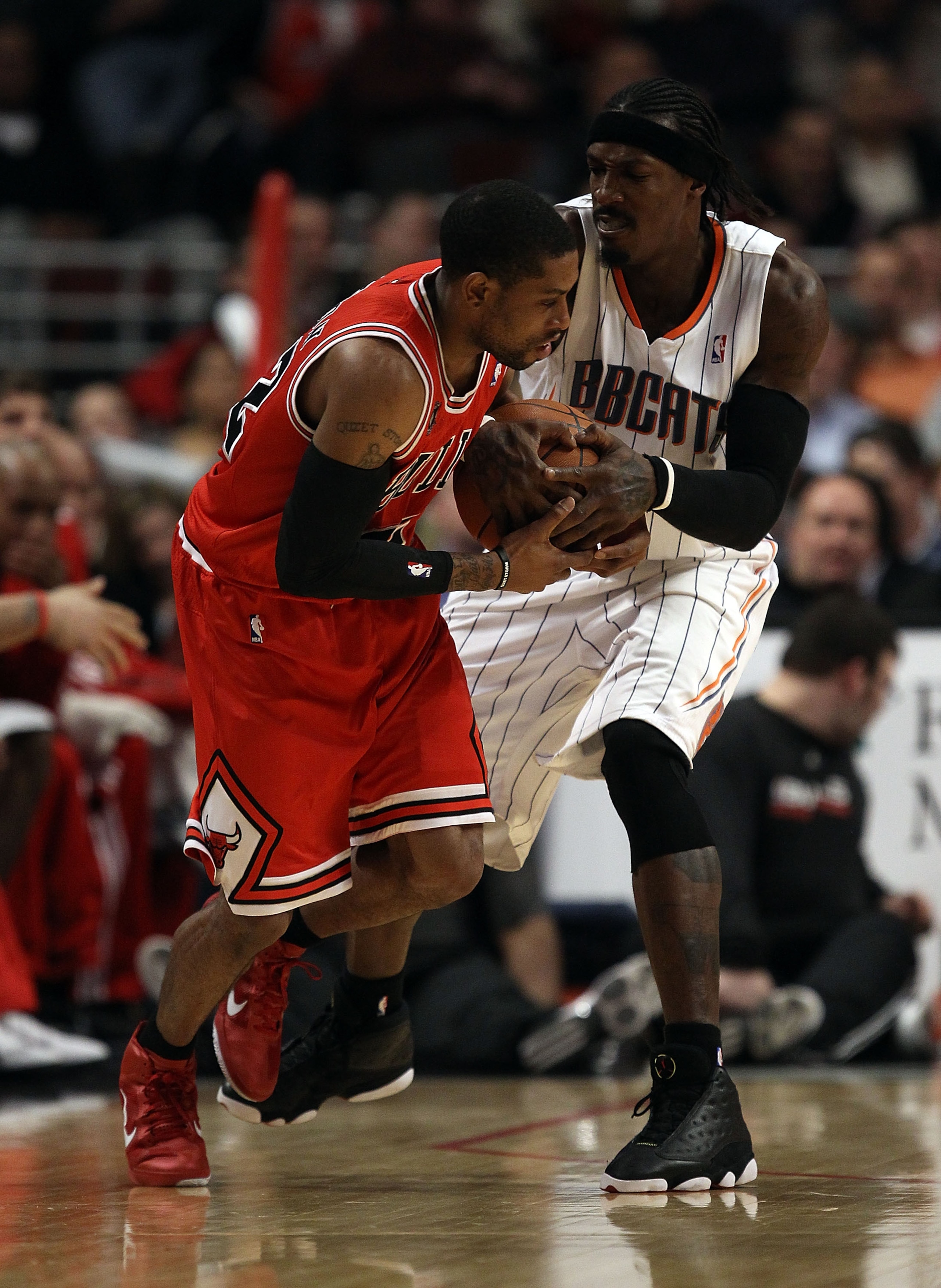 CHICAGO, IL - FEBRUARY 15: C.J. Watson #32 of the Chicago Bulls and Gerald Wallace #3 of the Charlotte Bobcats battle for the ball at the United Center on February 15, 2011 in Chicago, Illinois. The Bulls defeated the Bobcats 106-94. NOTE TO USER: User ex