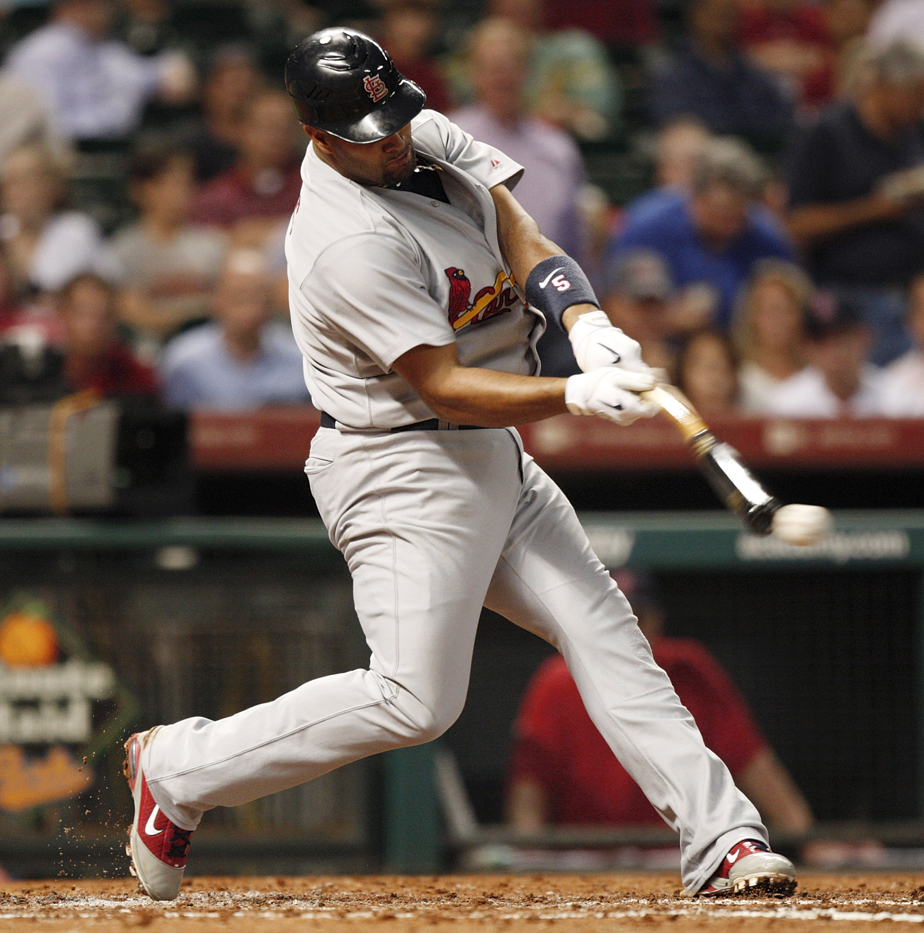 St. Louis Cardinals slugger Albert Pujols stops his autograph