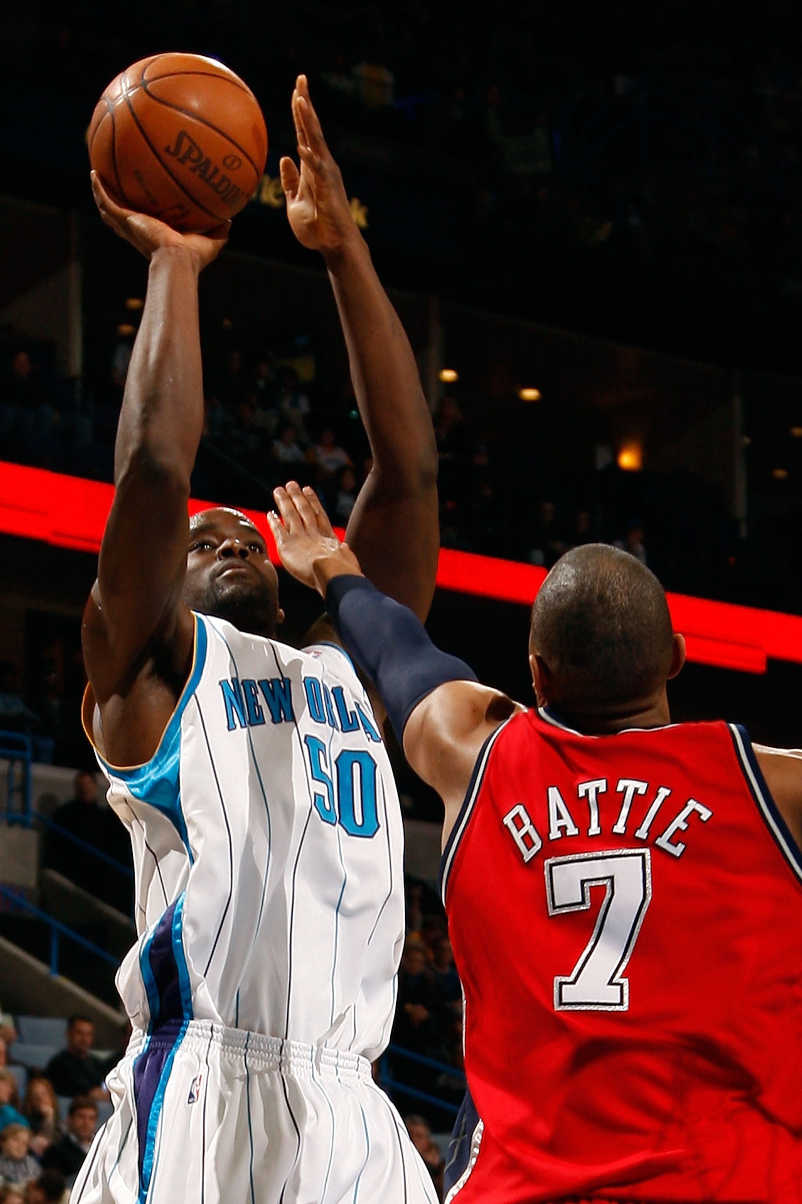 NEW ORLEANS - JANUARY 08:  Emeka Okafor #50 of the New Orleans Hornets shoots the ball over Tony Battie #7 of the New Jersey Nets at the New Orleans Arena on January 8, 2010 in New Orleans, Louisiana.  NOTE TO USER: User expressly acknowledges and agrees