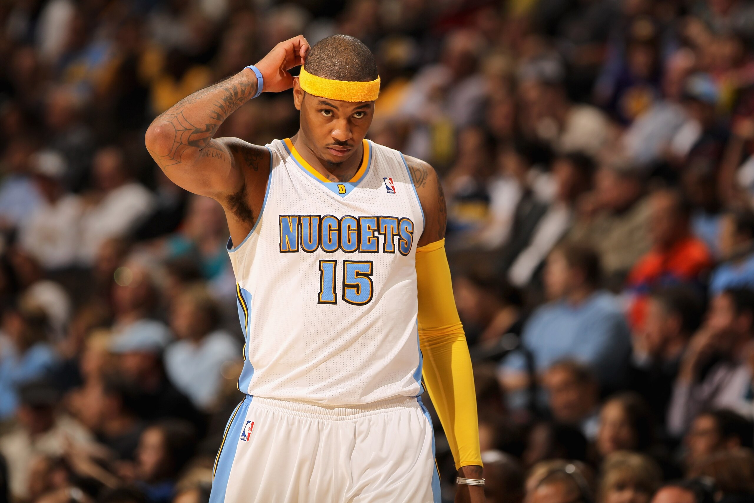 DENVER - NOVEMBER 11: Carmelo Anthony #15 of the Denver Nuggets looks on during a break in the action against the Los Angeles Lakers at the Pepsi Center on November 11, 2010 in Denver, Colorado. The Nuggets defeated the Lakers 118-112. NOTE TO USER: Use DENVER - NOVEMBER 11: Carmelo Anthony #15 of the Denver Nuggets looks on during a break in the action against the Los Angeles Lakers at the Pepsi Center on November 11, 2010 in Denver, Colorado. The Nuggets defeated the Lakers 118-112. NOTE TO USER: Use