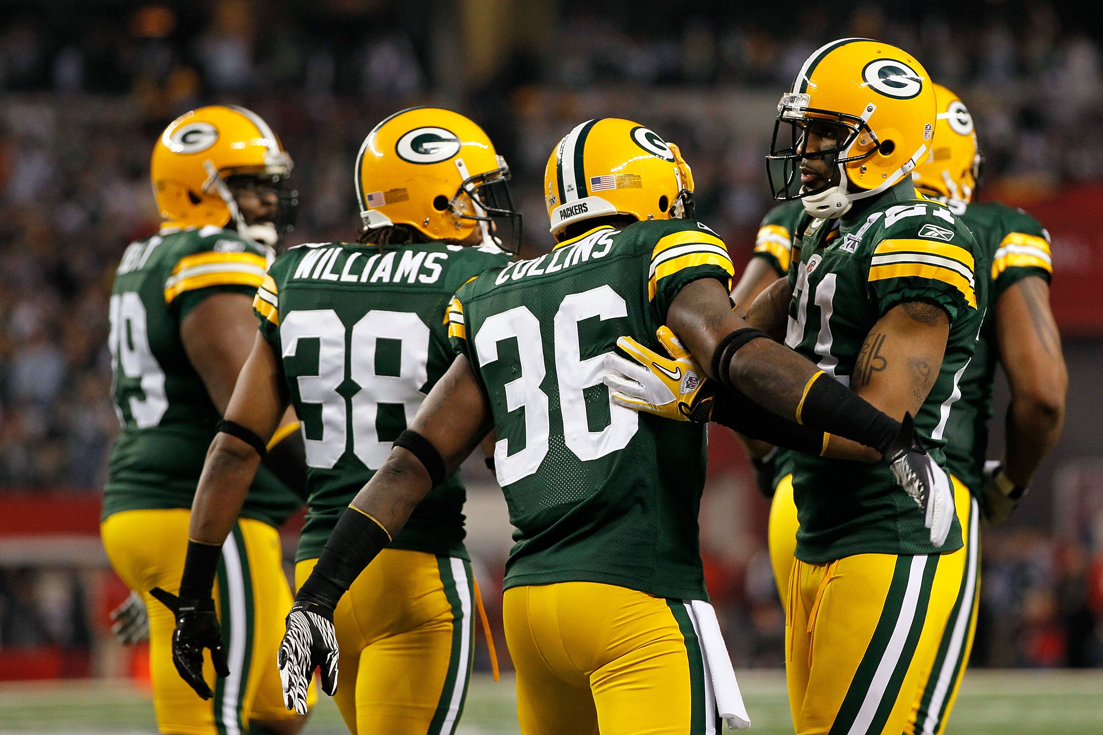 ARLINGTON, TX - FEBRUARY 06:  Charles Woodson (R) #21 of the Green Bay Packers congratulates Nick Collins #36 after COllins scored a touchdown on an interception return against the Pittsburgh Steelers during Super Bowl XLV at Cowboys Stadium on February 6