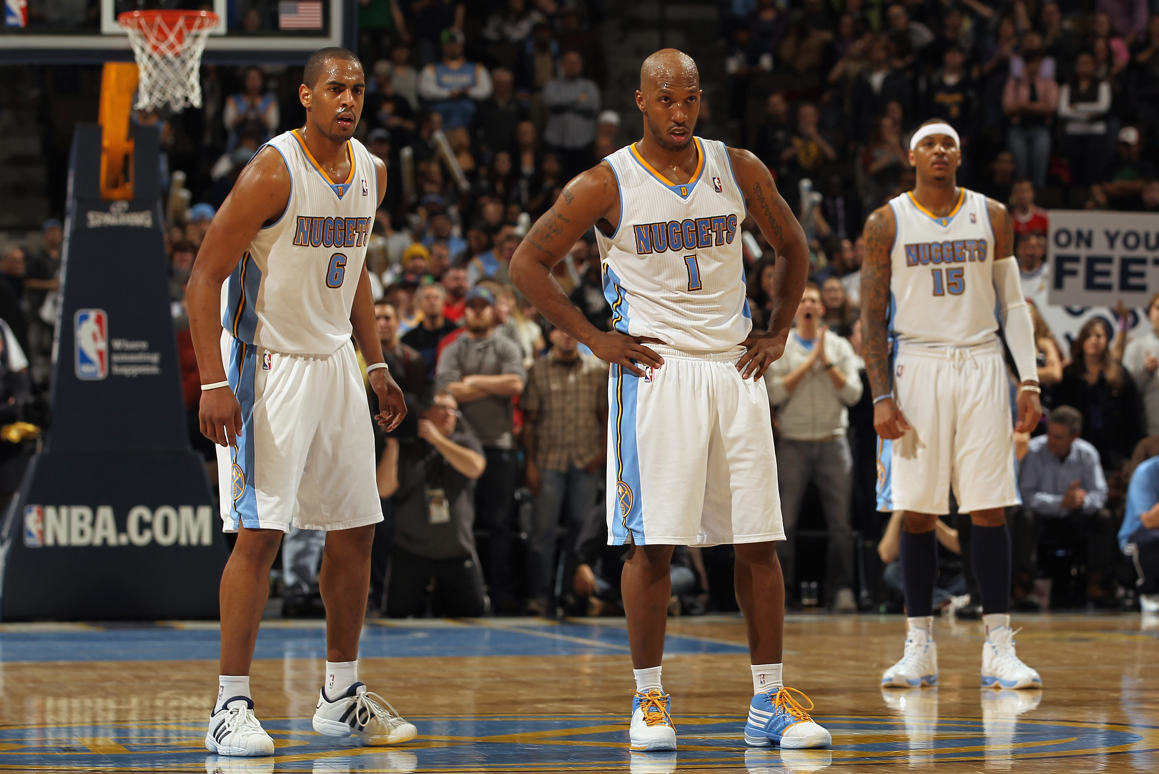 DENVER, CO - FEBRUARY 10:  Arron Afflalo #6, Chauncey Billups #1 and Carmelo Anthony #15 of the Denver Nuggets look on during a break in the action against the Dallas Mavericks during NBA action at the Pepsi Center on February 10, 2011 in Denver, Colorado