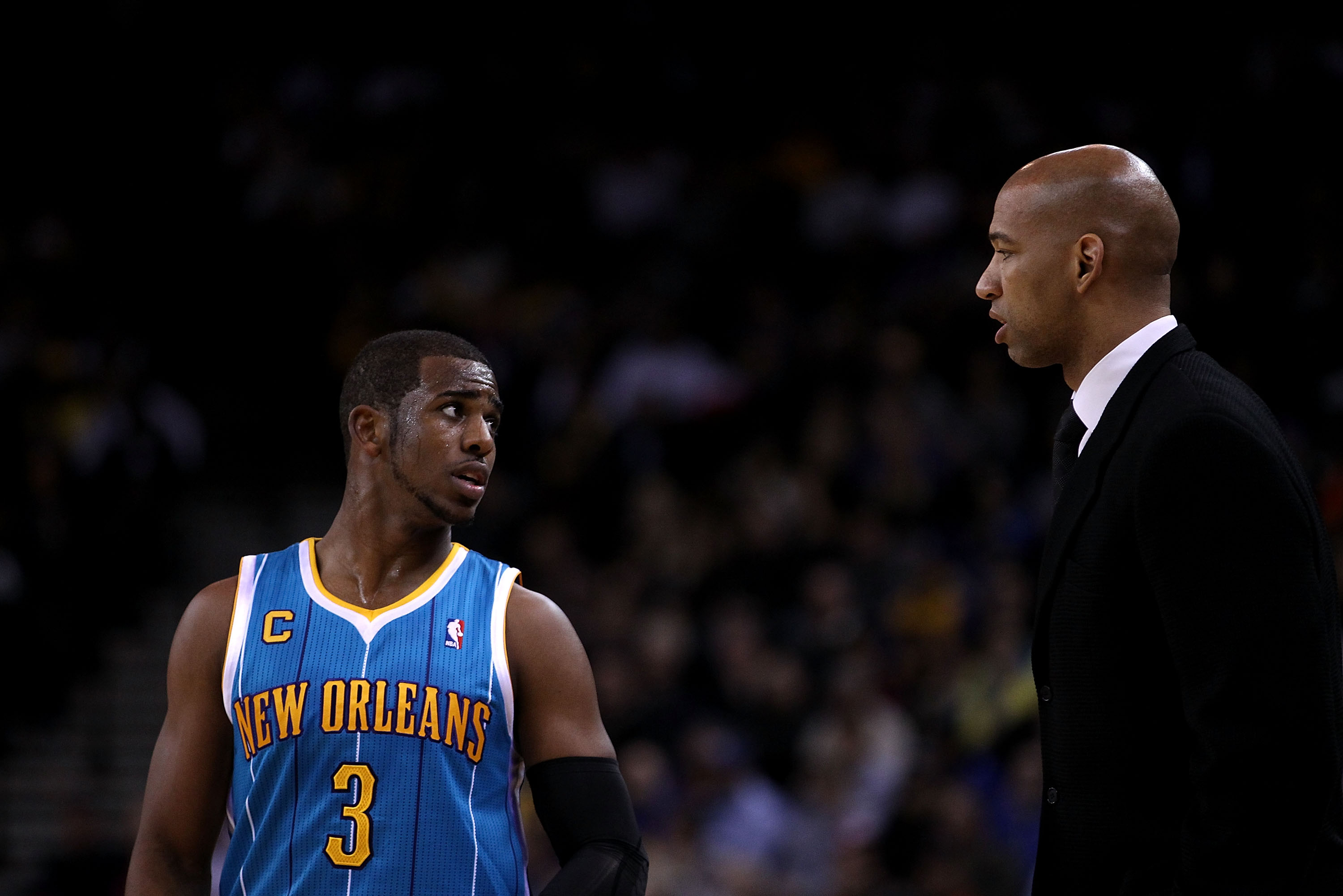 OAKLAND, CA - FEBRUARY 15:  Chris Paul #3 of the New Orleans Hornets speaks to head coach Monty Williams at Oracle Arena on February 15, 2011 in Oakland, California. NOTE TO USER: User expressly acknowledges and agrees that, by downloading and or using th