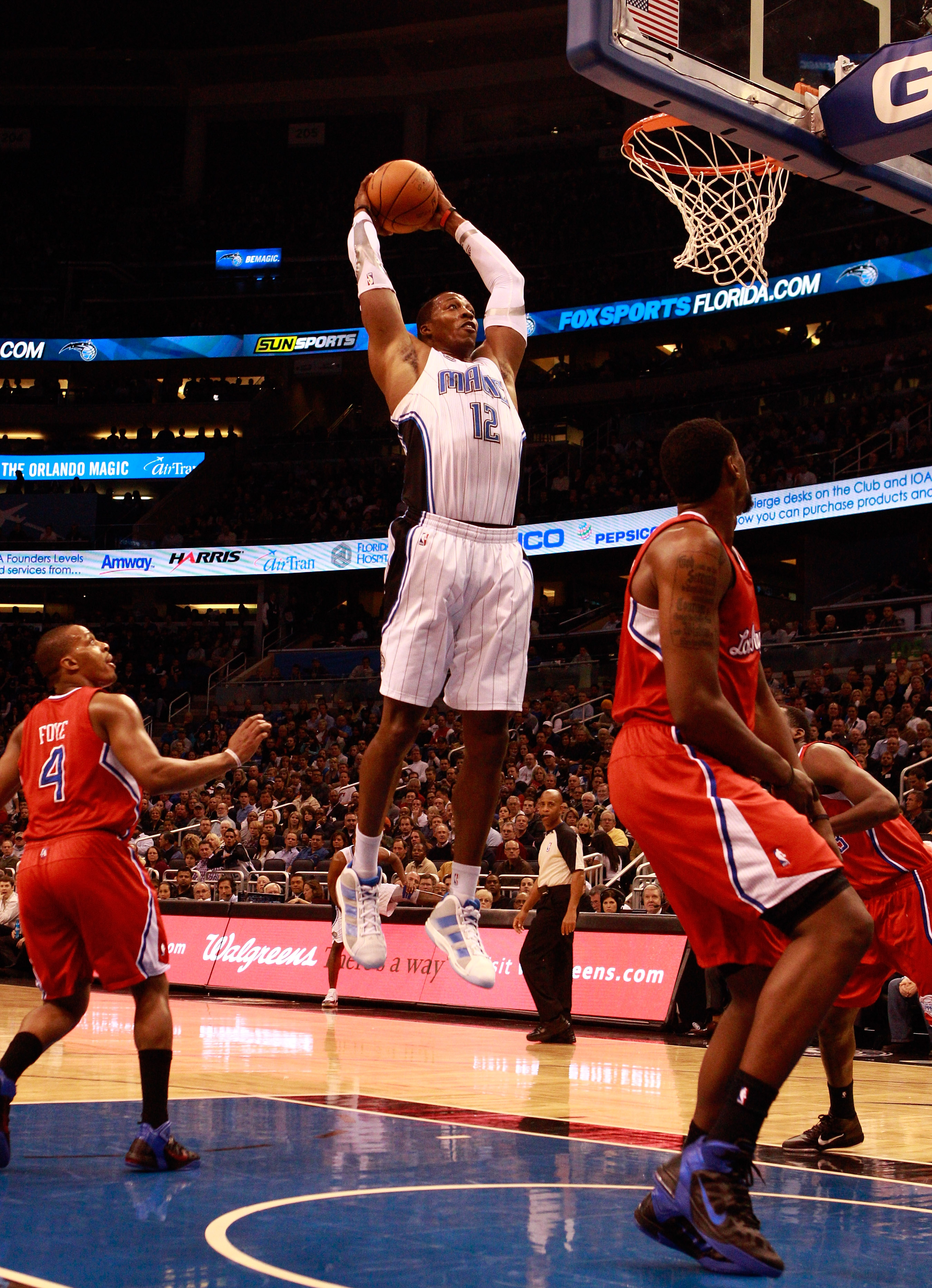 ORLANDO, FL - FEBRUARY 08:  Dwight Howard #12 of the Orlando Magic attempts a shot during a game against the Los Angeles Clippers at Amway Arena on February 8, 2011 in Orlando, Florida.  NOTE TO USER: User expressly acknowledges and agrees that, by downlo