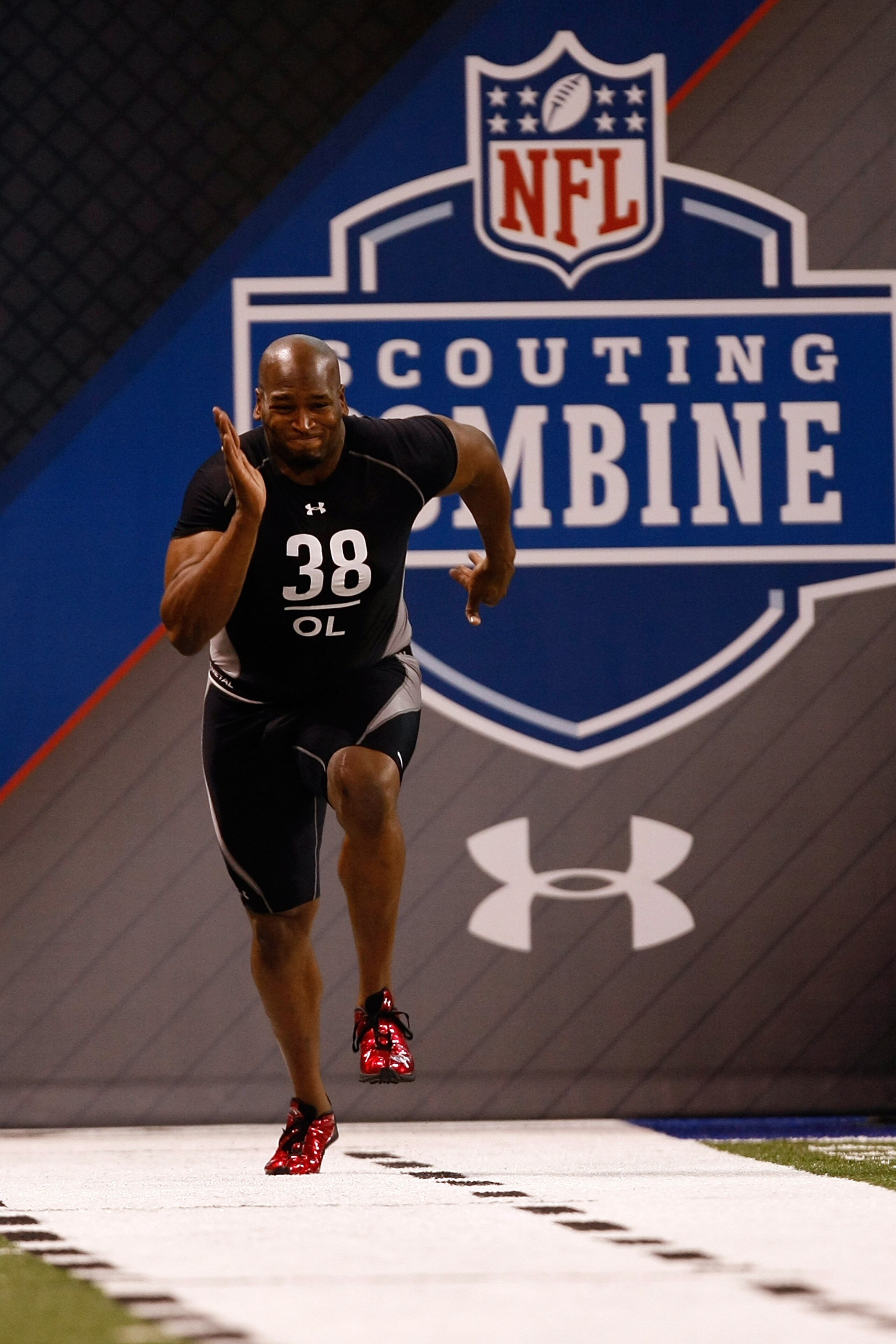INDIANAPOLIS, IN - FEBRUARY 21: Offensive lineman Eugene Monroe of Virginia runs the 40 yard dash as he participates in drills during the NFL Scouting Combine presented by Under Armour at Lucas Oil Stadium on February 21, 2009 in Indianapolis, Indiana. ( INDIANAPOLIS, IN - FEBRUARY 21: Offensive lineman Eugene Monroe of Virginia runs the 40 yard dash as he participates in drills during the NFL Scouting Combine presented by Under Armour at Lucas Oil Stadium on February 21, 2009 in Indianapolis, Indiana. (