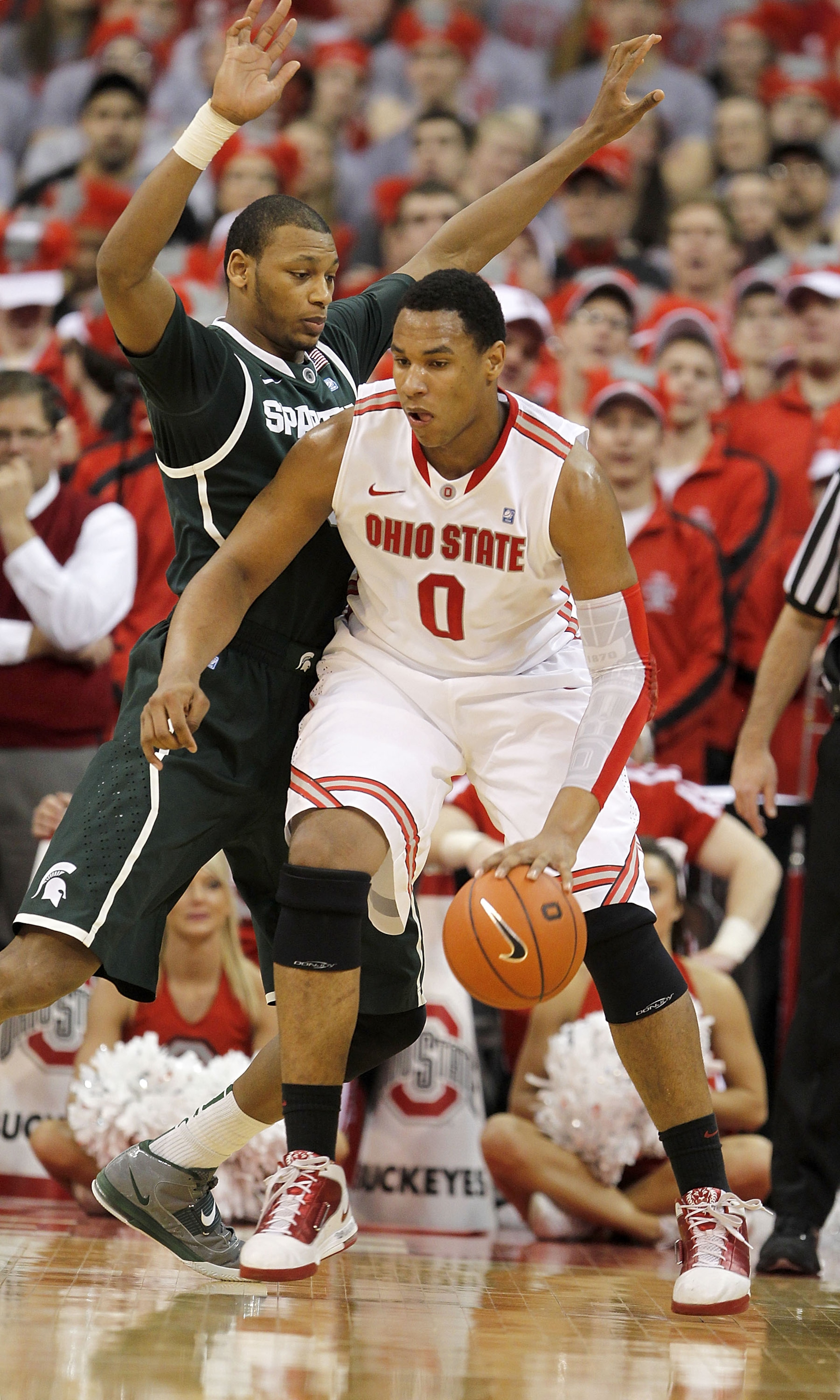 COLUMBUS, OH - FEBRUARY 15: Adreian Payne #5 of the Michigan State Spartans guards Jared Sullinger #0 of the Ohio State Buckeyes during the first half on February 15, 2011 at Value City Arena in Columbus, Ohio.  (Photo by Gregory Shamus/Getty Images)