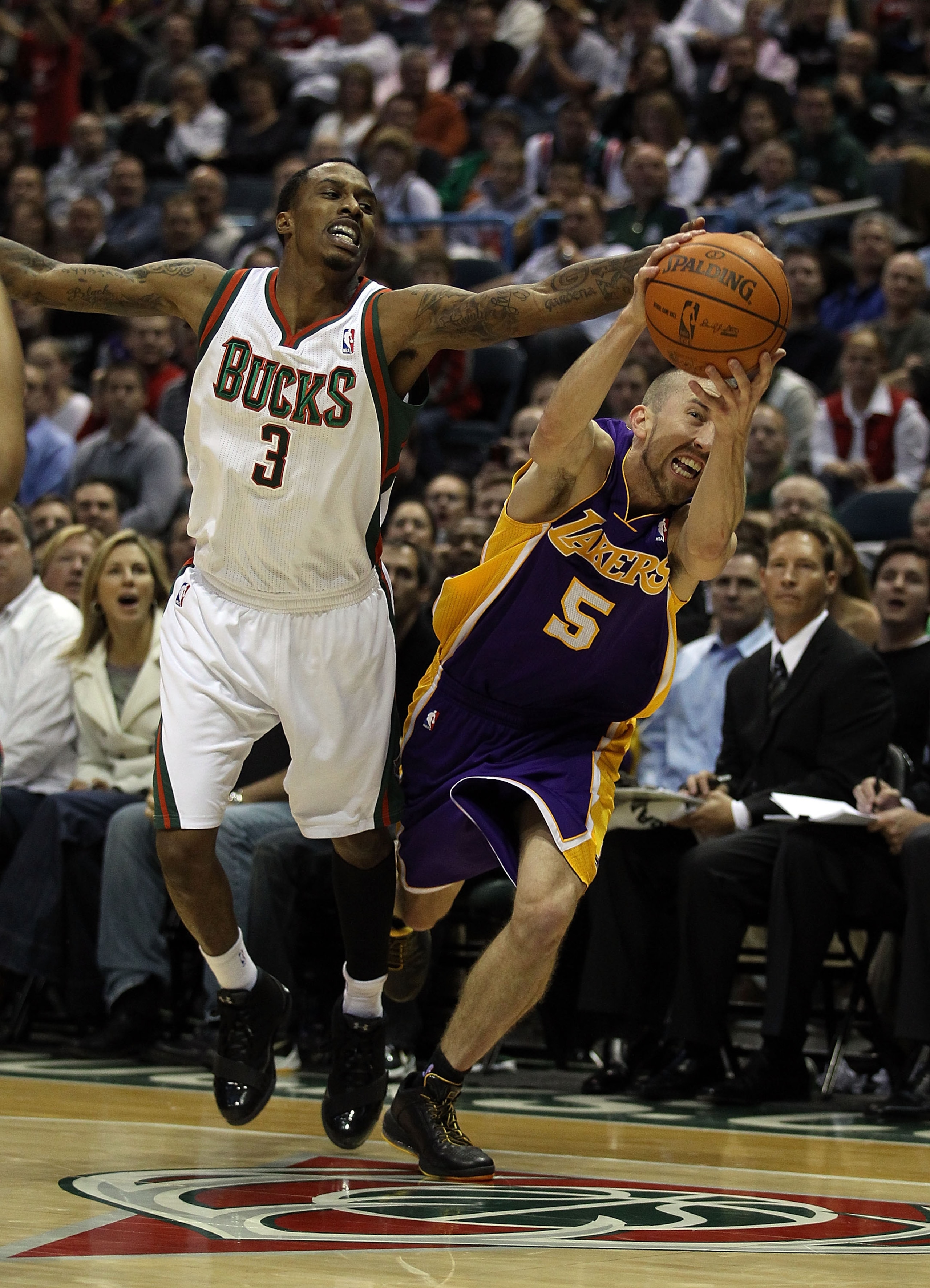 MILWAUKEE, WI - NOVEMBER 16: Brandon Jennings #3 of the Milwaukee Bucks and Steve Blake #5 of the Los Angeles Lakers battle for a loose ball at the Bradley Center on November 16, 2010 in Milwaukee, Wisconsin. The Lakers defeated the Bucks 118-107. NOTE TO