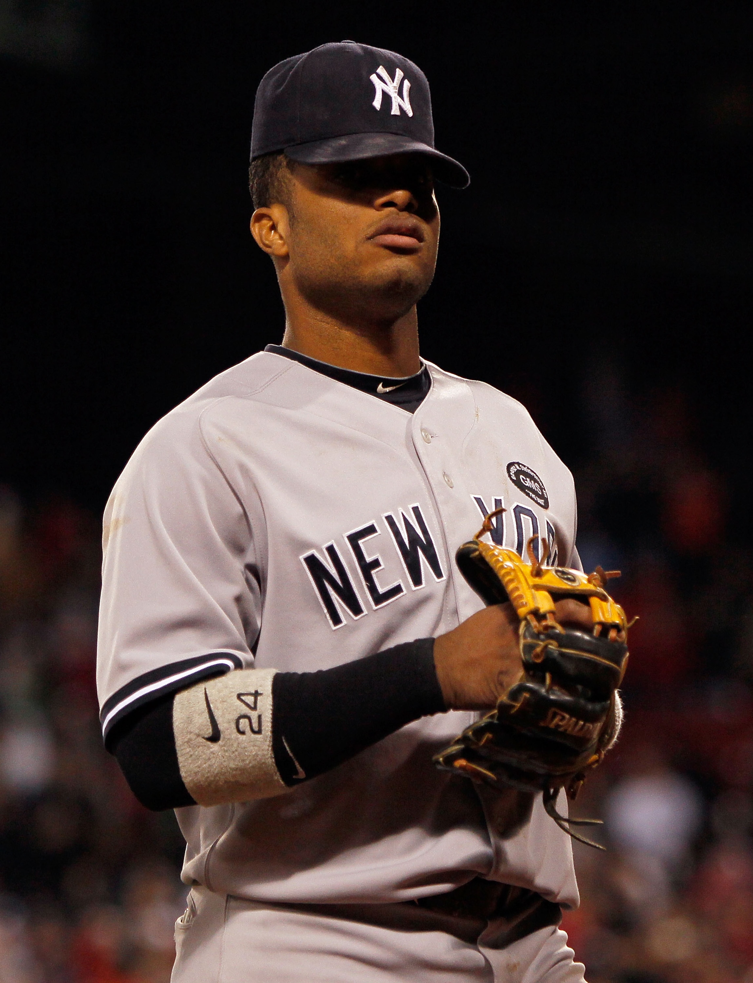 BOSTON - OCTOBER 2:  Robinson Cano #24 of the New York Yankees leaves the field after teammate Ivan Nova allowed a hit to Eric Petterson #3 of the Boston Red Sox in the tenth inning, which knocked in the winning run, in the second game of a doubleheader a
