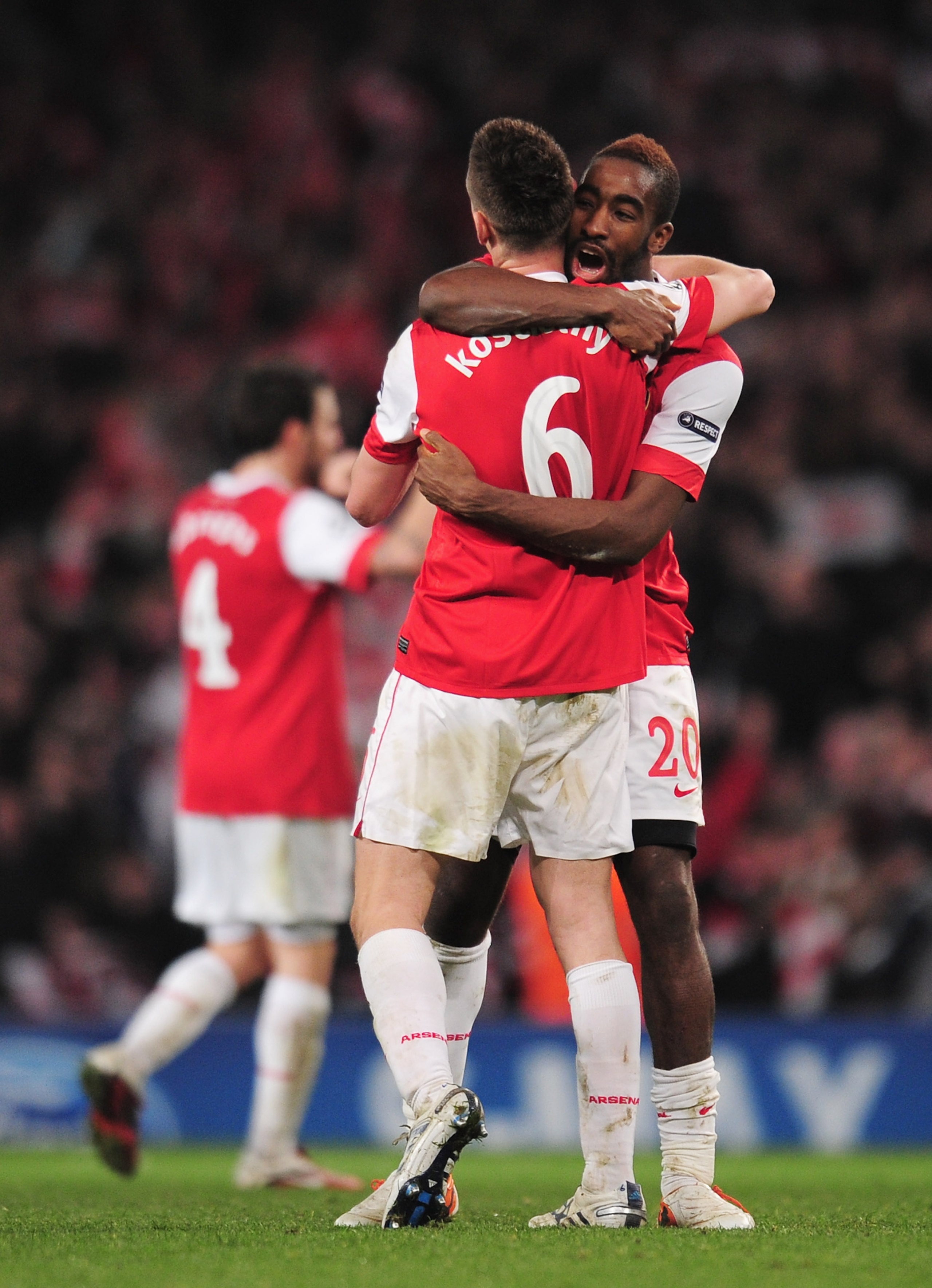 LONDON, ENGLAND - FEBRUARY 16:  Johan Djourou of Arsenal celebrates victory with Laurent Koscielny after the UEFA Champions League round of 16 first leg match between Arsenal and Barcelona at the Emirates Stadium on February 16, 2011 in London, England.  