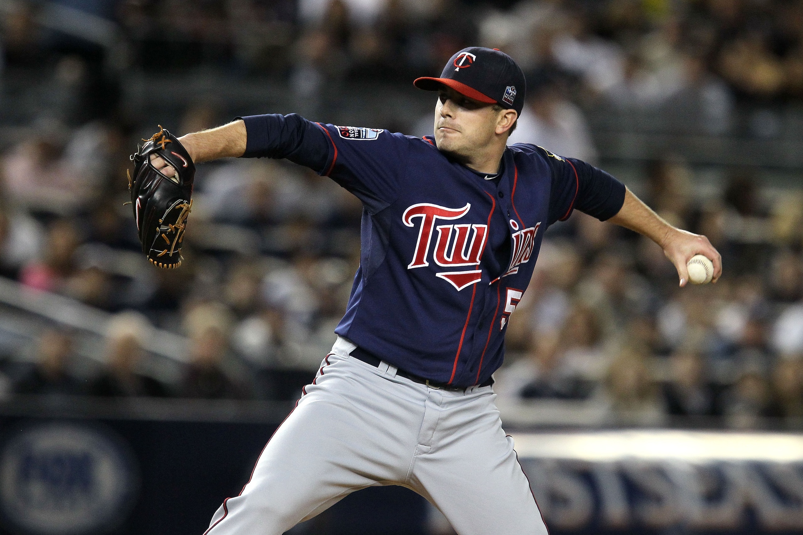NEW YORK - OCTOBER 09:  Starting pitcher Brian Duensing #52 of the Minnesota Twins throws a pitch against the New York Yankees during Game Three of the ALDS part of the 2010 MLB Playoffs at Yankee Stadium on October 9, 2010 in the Bronx borough of New Yor