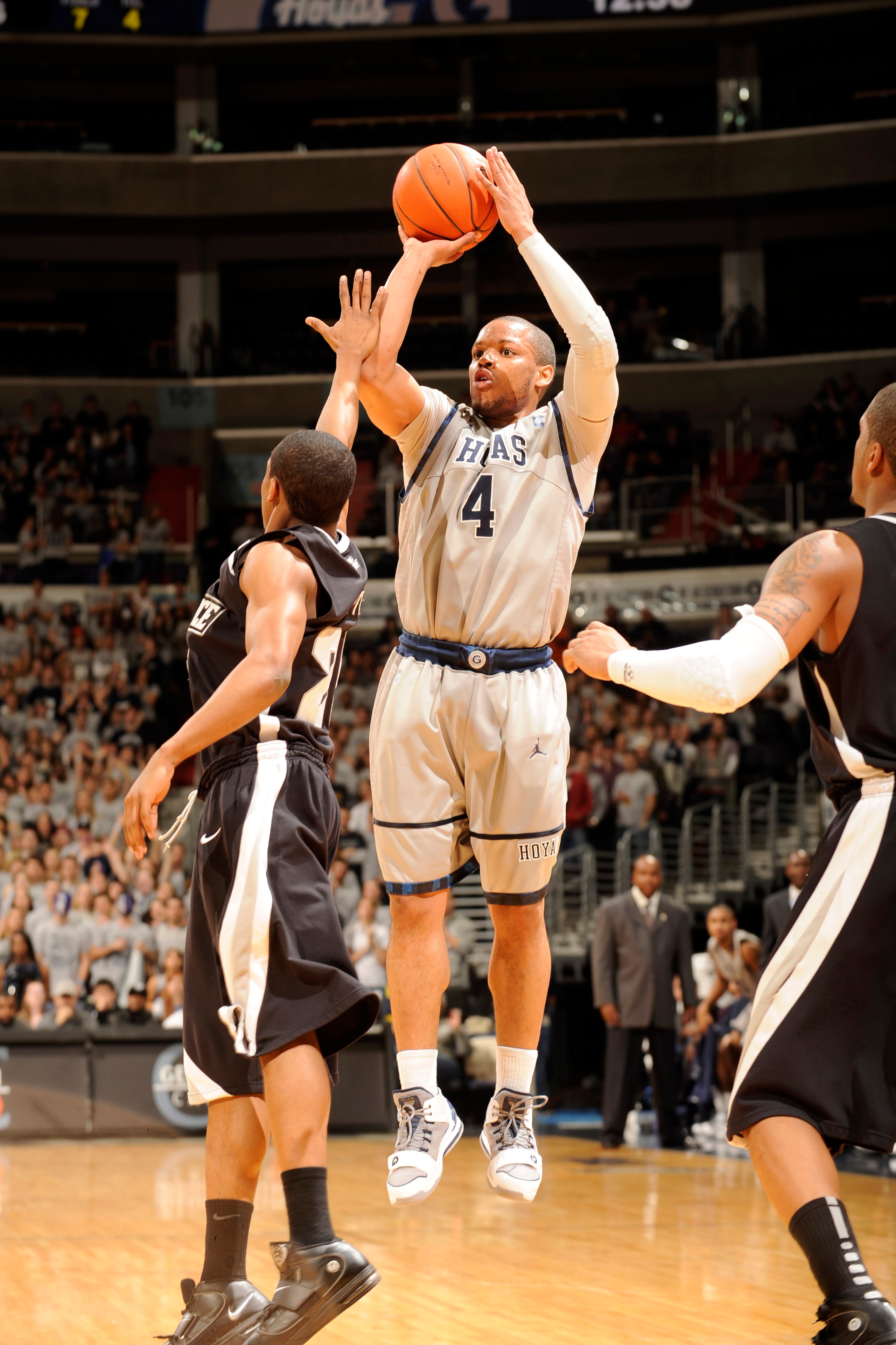 WASHINGTON, DC - FEBRUARY 5:  Chris Wright #4 of the Georgetown Hoyas takes a jump shot during a college basketball against the Providence Friars on February 5, 2011 at the Verizon Center in Washington, DC.  The Hoyas won 83-81.  (Photo by Mitchell Layton