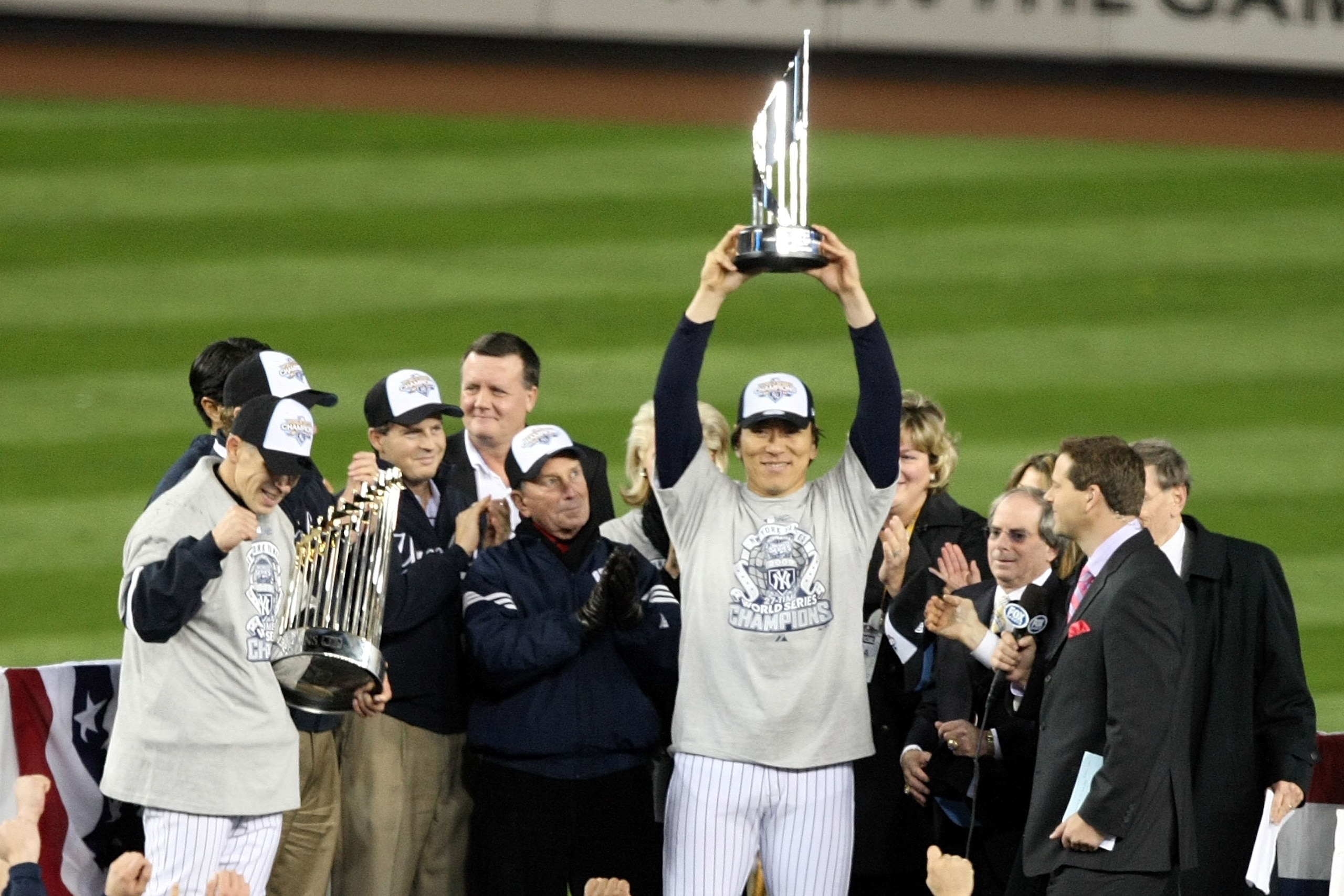 NEW YORK - NOVEMBER 04:  World Series MVP Hideki Matsui #55 of the New York Yankees holds up the MVP trophy as he celebrates their 7-3 win against the Philadelphia Phillies in Game Six of the 2009 MLB World Series at Yankee Stadium on November 4, 2009 in