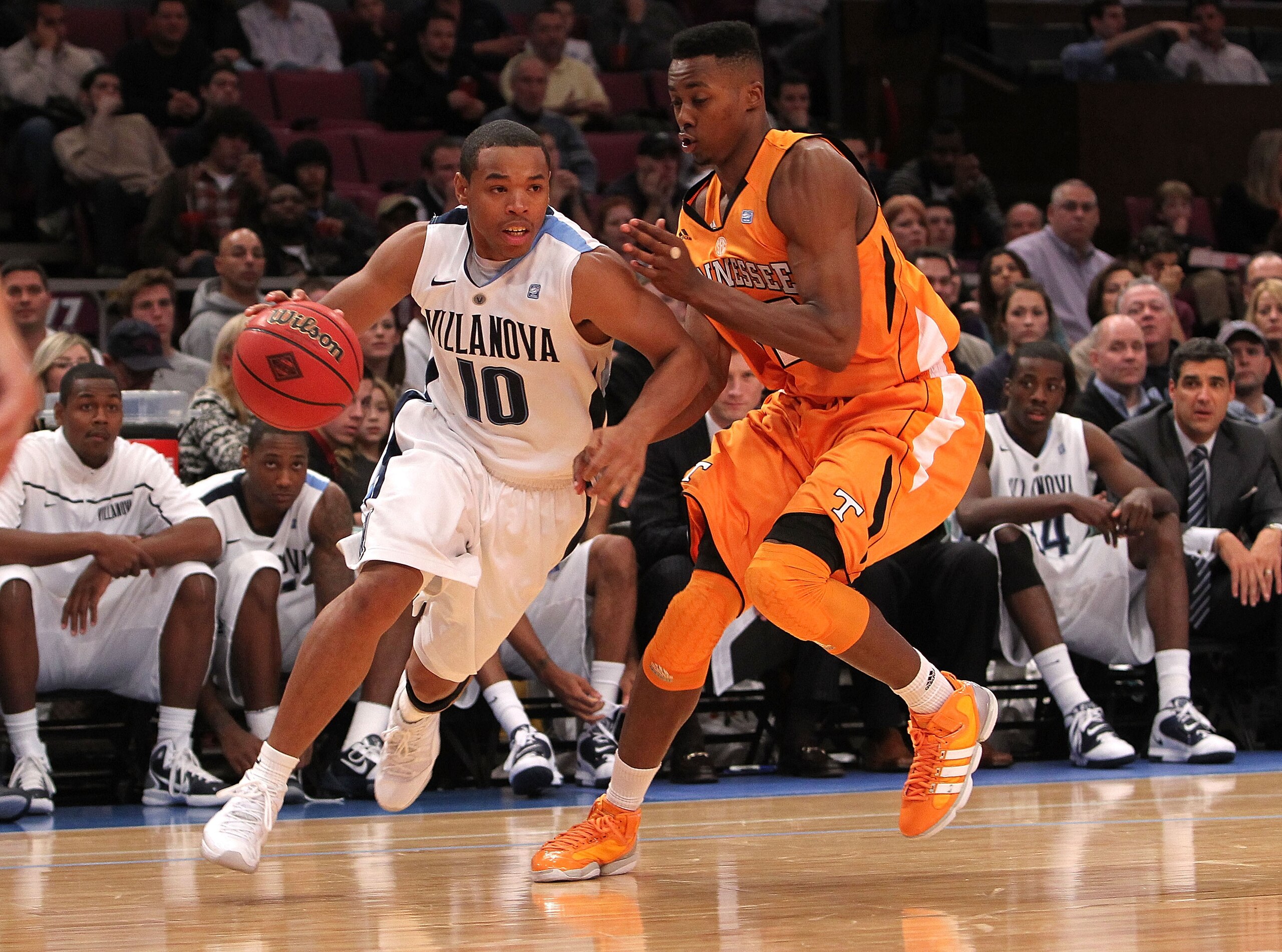 NEW YORK - NOVEMBER 26:  Corey Fisher #10 of the Villanova Wildcats drives to the basket alongside Scotty Hopson #32 of the Tennessee Volunteers during the Championship game at Madison Square Garden on November 26, 2010 in New York City.  (Photo by Nick L