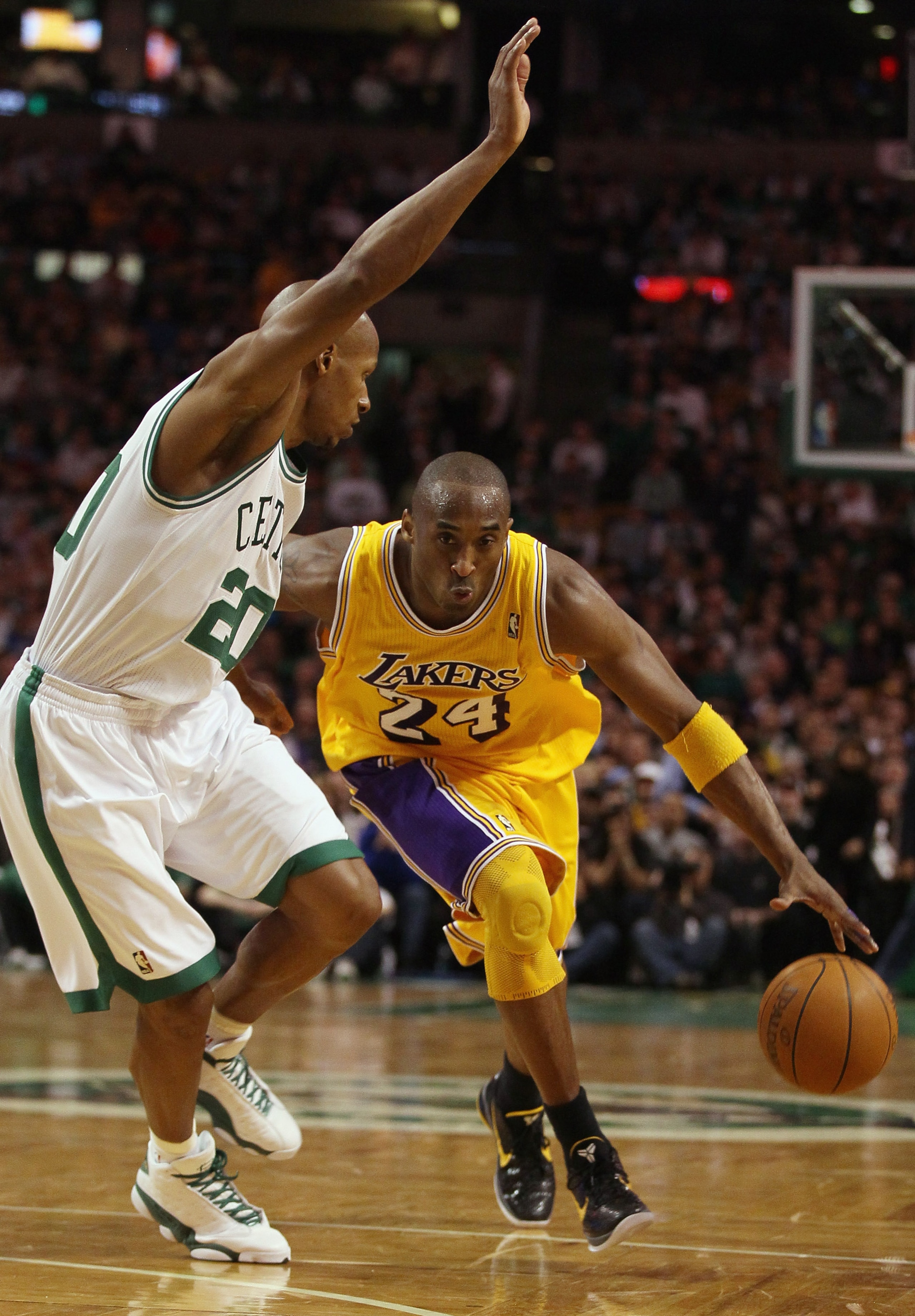BOSTON, MA - FEBRUARY 10:  Kobe Bryant #24 of the Los Angeles Lakers drives around Ray Allen #20 of the Boston Celtics on February 10, 2011 at the TD Garden in Boston, Massachusetts.  The Lakers defeated the Celtics 92-86. NOTE TO USER: User expressly ack