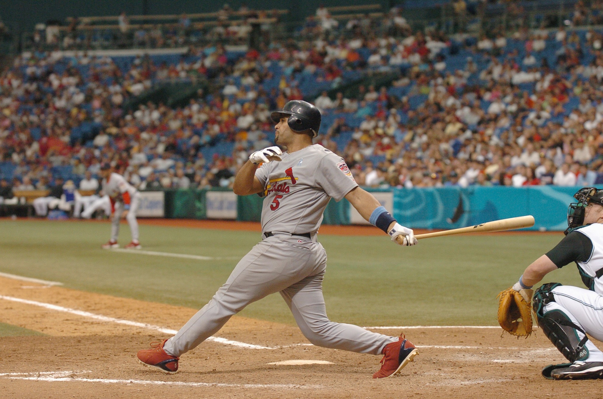 ST. PETERSBURGH, FLORIDA - JUNE 19:  Albert Pujols #5 of the St. Louis Cardinals swings at the pitch during the game against the Tampa Bay Devil Rays at Tampa Bay Devil Rays Stadium on June 19,2005 in St. Petersburg, Florida. (Photo by: Steve Kovich/Getty