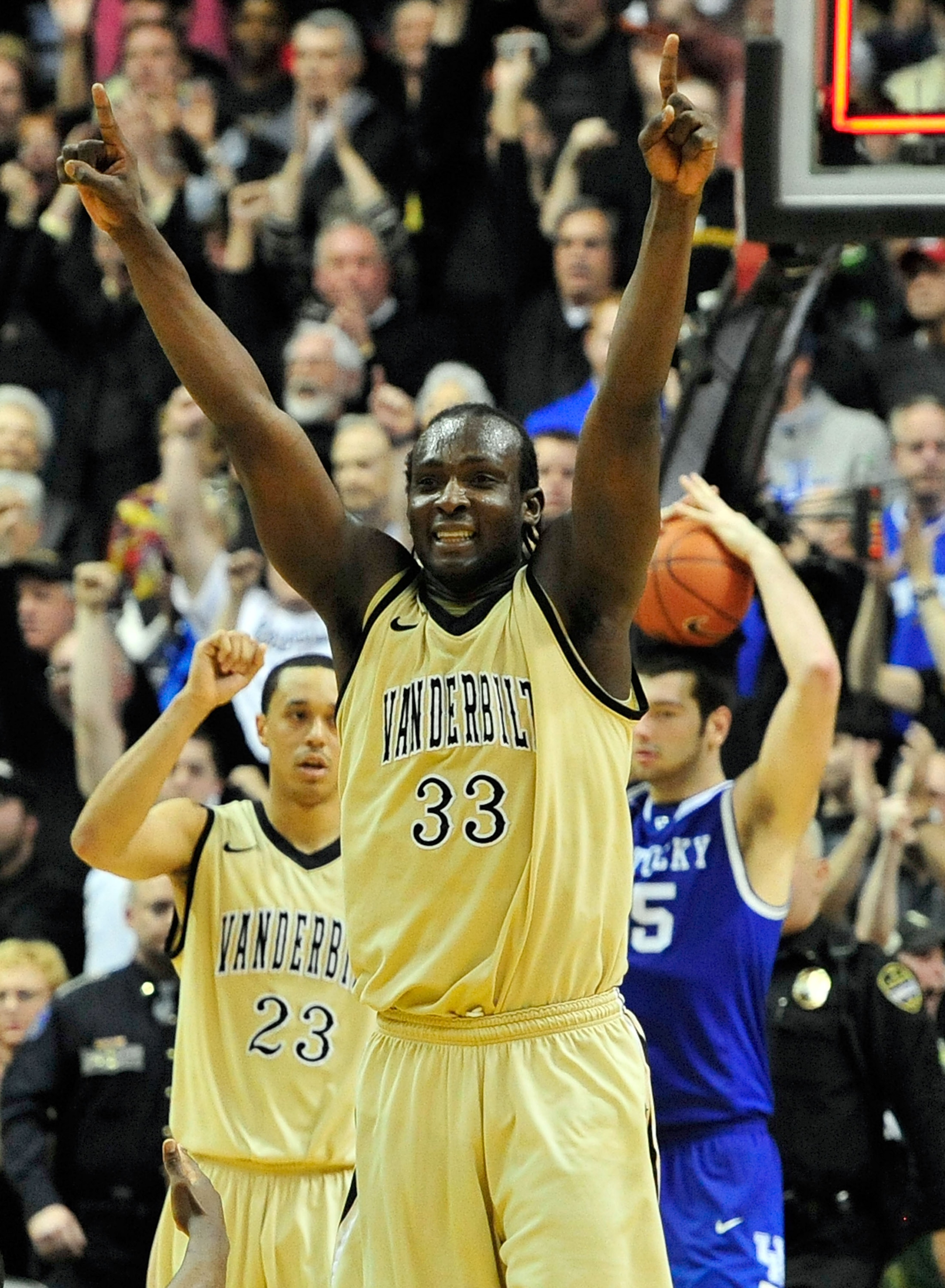 NASHVILLE, TN - FEBRUARY 12:  John Jenkins #23 and Steve Tchiengang #33 of the Vanderbilt Commodores celebrate after a win over the Kentucky Wildcats at Memorial Gym on February 12, 2011 in Nashville, Tennessee. Vanderbilt won 81-77.  (Photo by Grant Halv