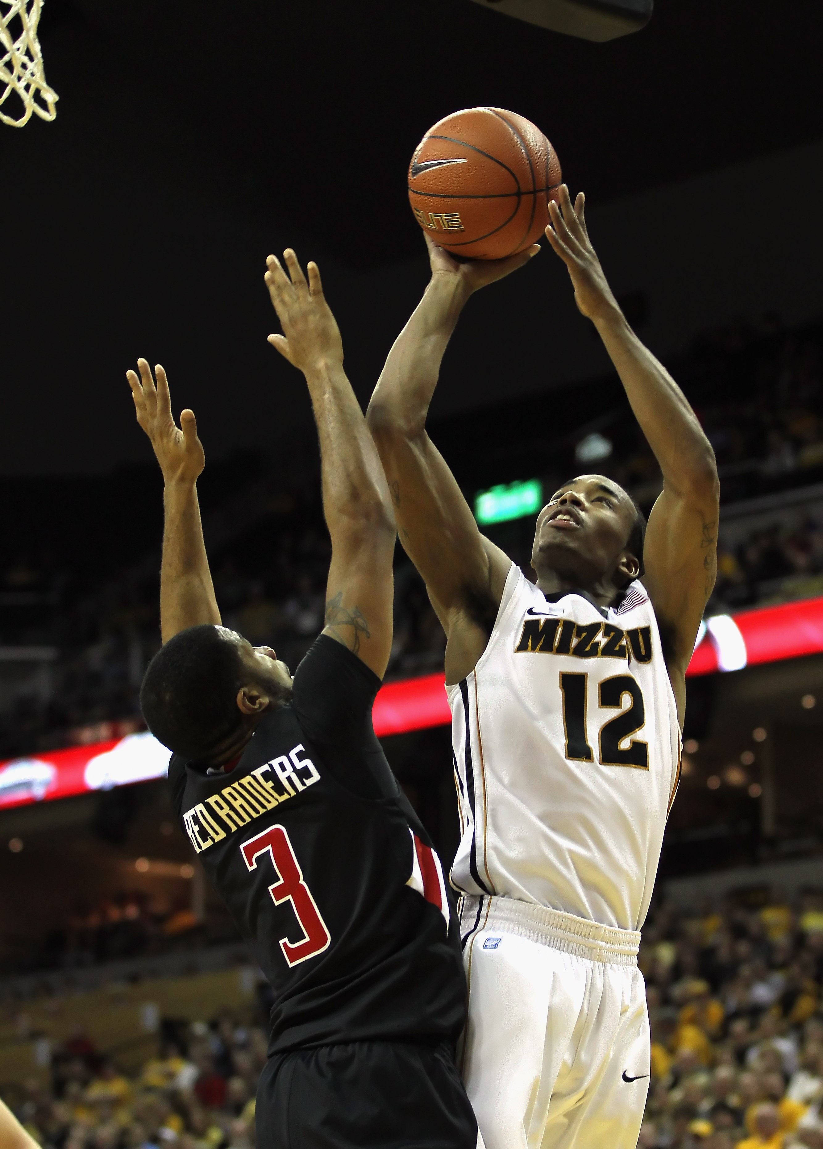 COLUMBIA, MO - FEBRUARY 15:  Marcus Denmon #12 of the Missouri Tigers shoots over Javarez Willis #3 of the Texas Tech Red Raiders during the game on February 15, 2011 at Mizzou Arena in Columbia, Missouri.  (Photo by Jamie Squire/Getty Images)
