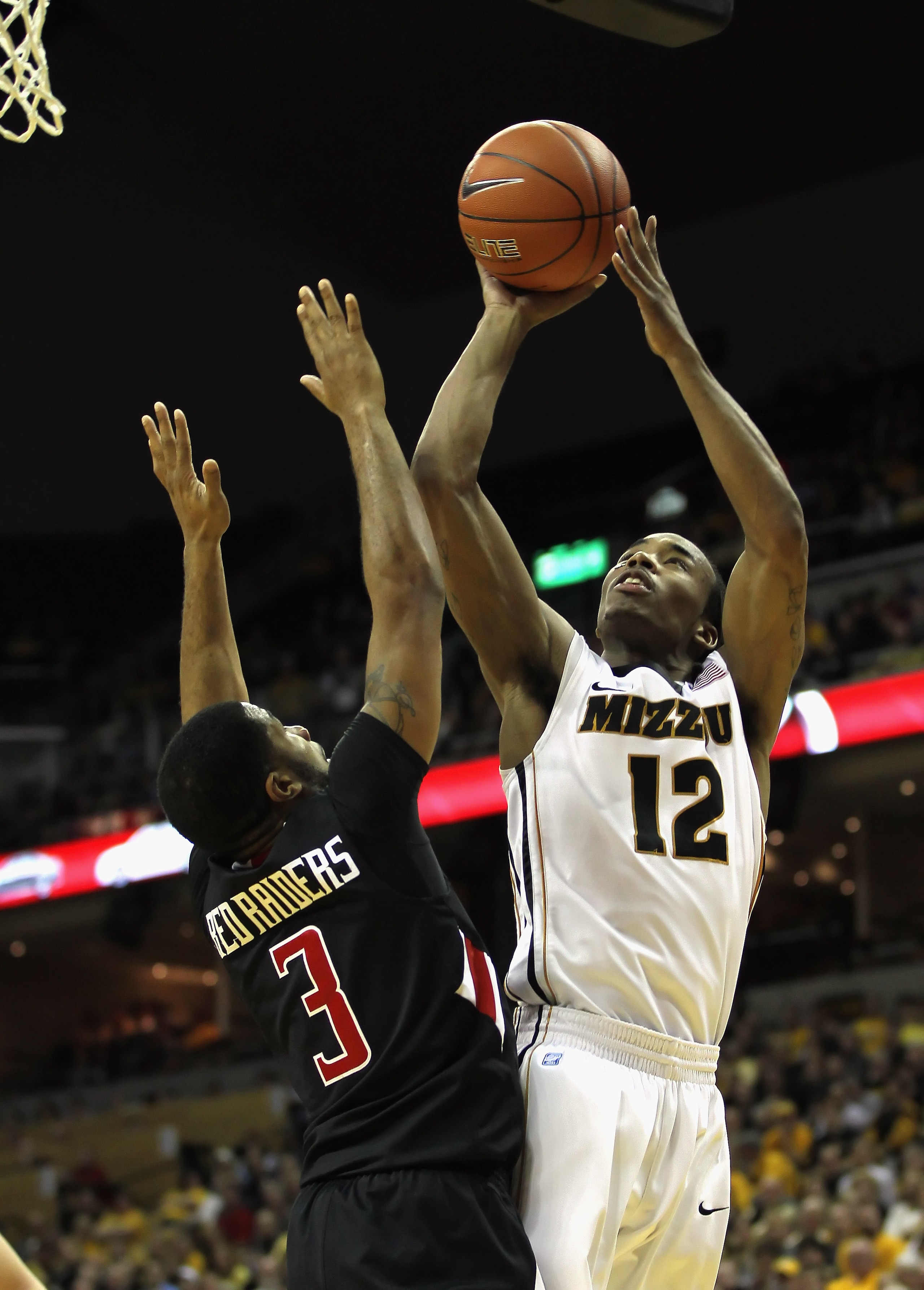 COLUMBIA, MO - FEBRUARY 15:  Marcus Denmon #12 of the Missouri Tigers shoots over Javarez Willis #3 of the Texas Tech Red Raiders during the game on February 15, 2011 at Mizzou Arena in Columbia, Missouri.  (Photo by Jamie Squire/Getty Images)