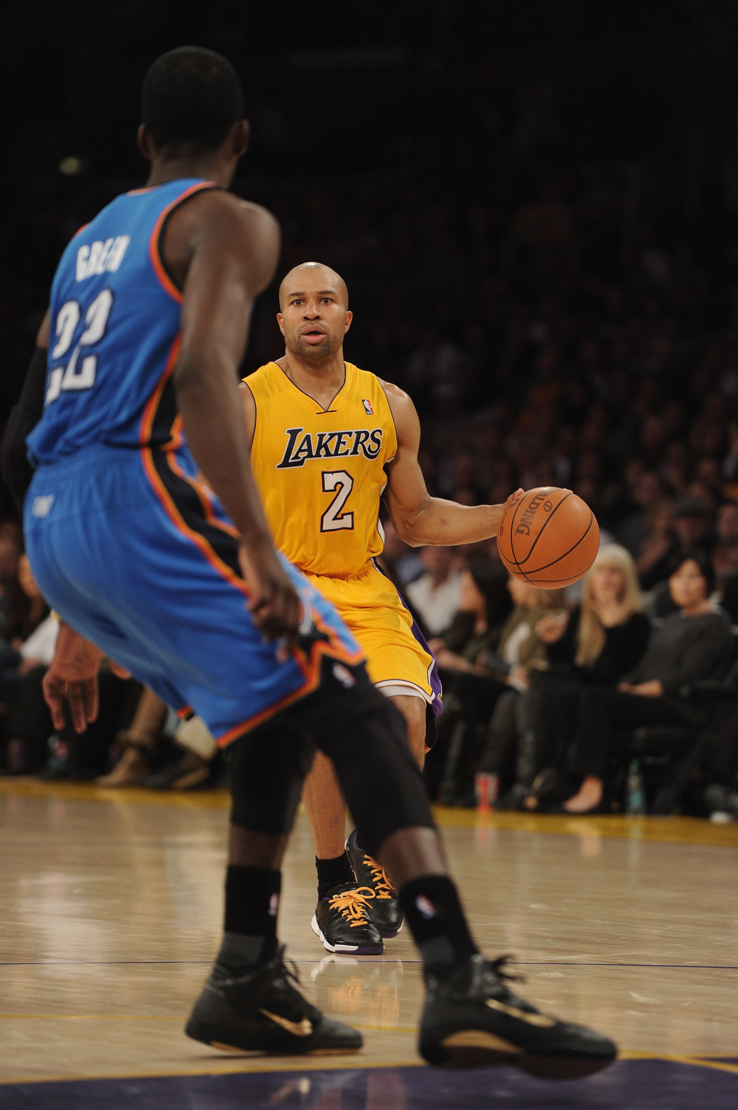 LOS ANGELES, CA - JANUARY 17:  Derek Fisher #2 of the Los Angeles Lakers dribbles up court in front of Jeff Green #22 of the Oklahoma City Thunder at the Staples Center on January 17, 2011 in Los Angeles, California.  (Photo by Harry How/Getty Images)   N