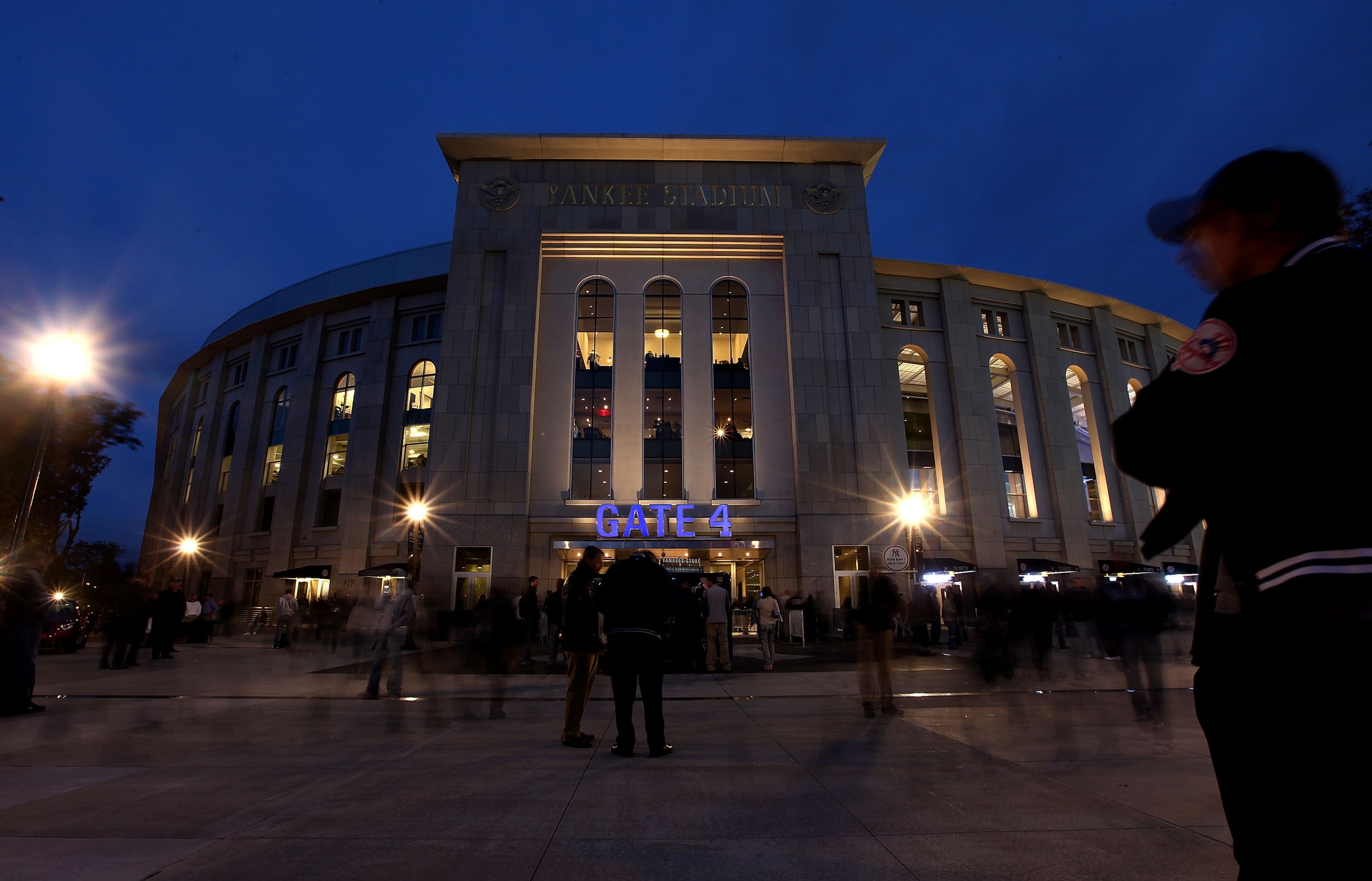 NEW YORK - OCTOBER 18:  Fans walks outside of Yankee Stadium before Game Three of the ALCS between the New York Yankees and the Texas Rangers during the 2010 MLB Playoffs at Yankee Stadium on October 18, 2010 in New York, New York.  (Photo by Andrew Burto