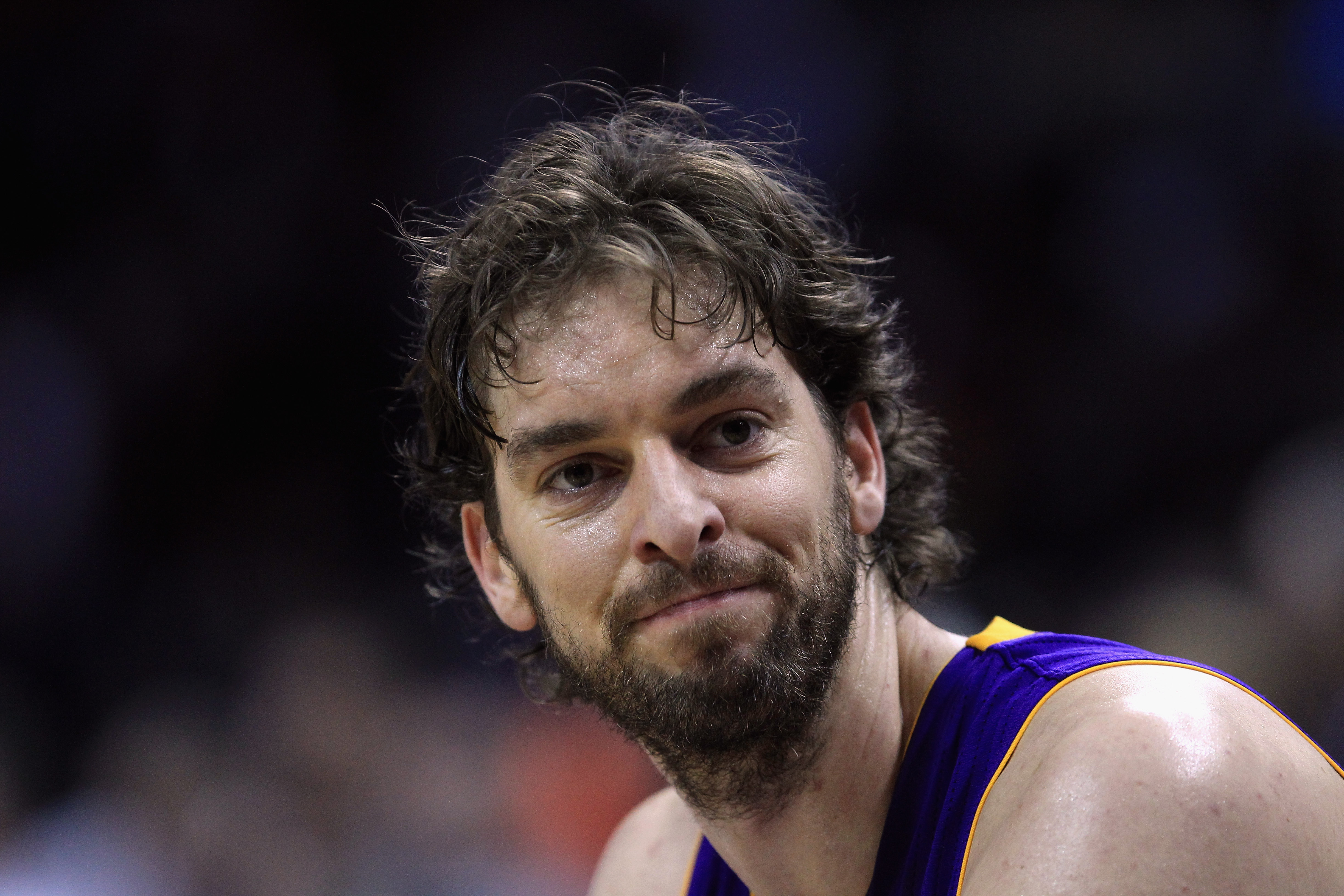 CHARLOTTE, NC - FEBRUARY 14:  Pau Gasol #16 of the Los Angeles Lakers reacts as he sits on the bench during their game against the Charlotte Bobcats at Time Warner Cable Arena on February 14, 2011 in Charlotte, North Carolina. NOTE TO USER: User expressly