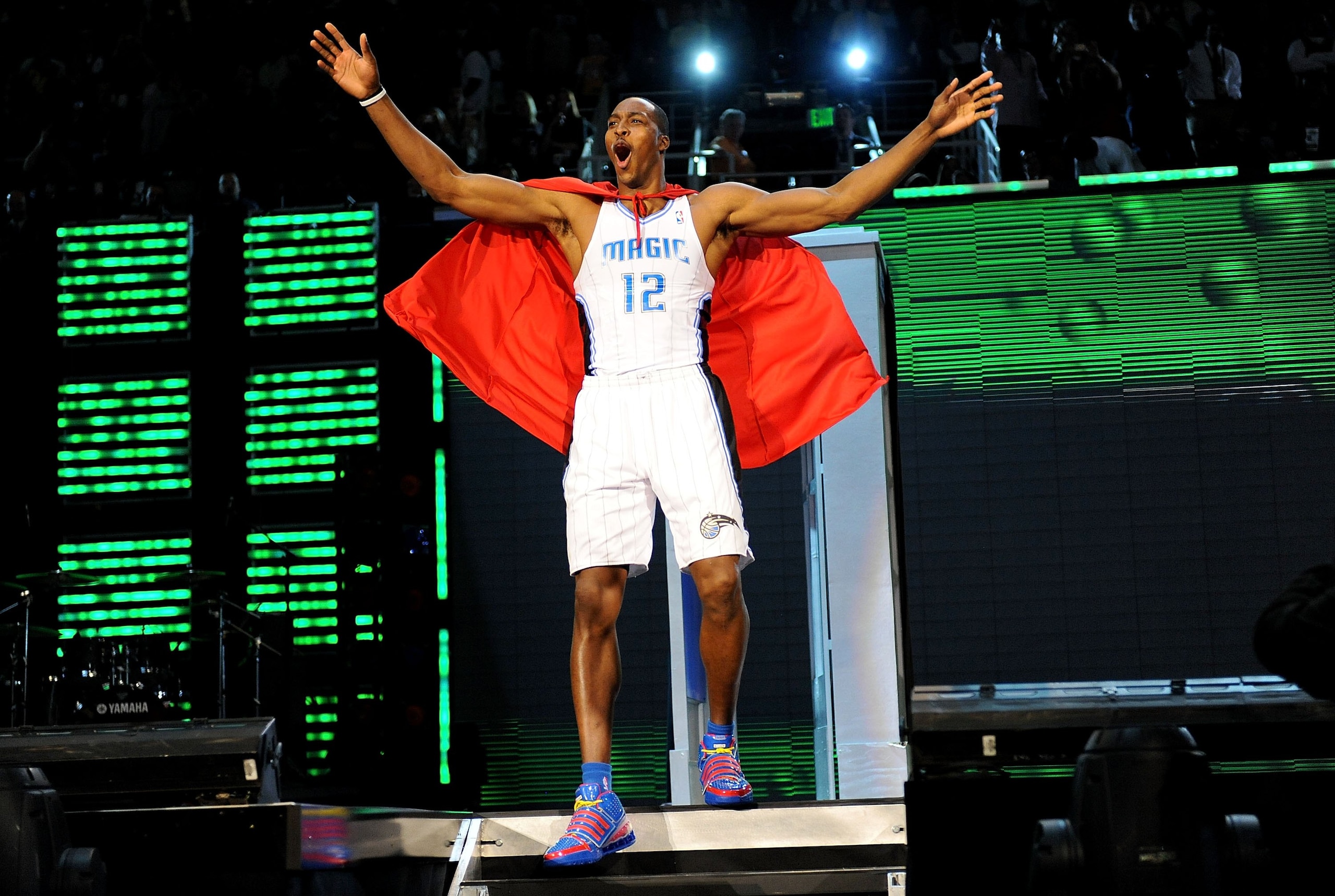 PHOENIX - FEBRUARY 14:  Dwight Howard of the Orlando Magic emerges from a phone booth wearing a Superman cape during the Sprite Slam Dunk Contest on All-Star Saturday Night, part of 2009 NBA All-Star Weekend at US Airways Center on February 14, 2009 in Ph